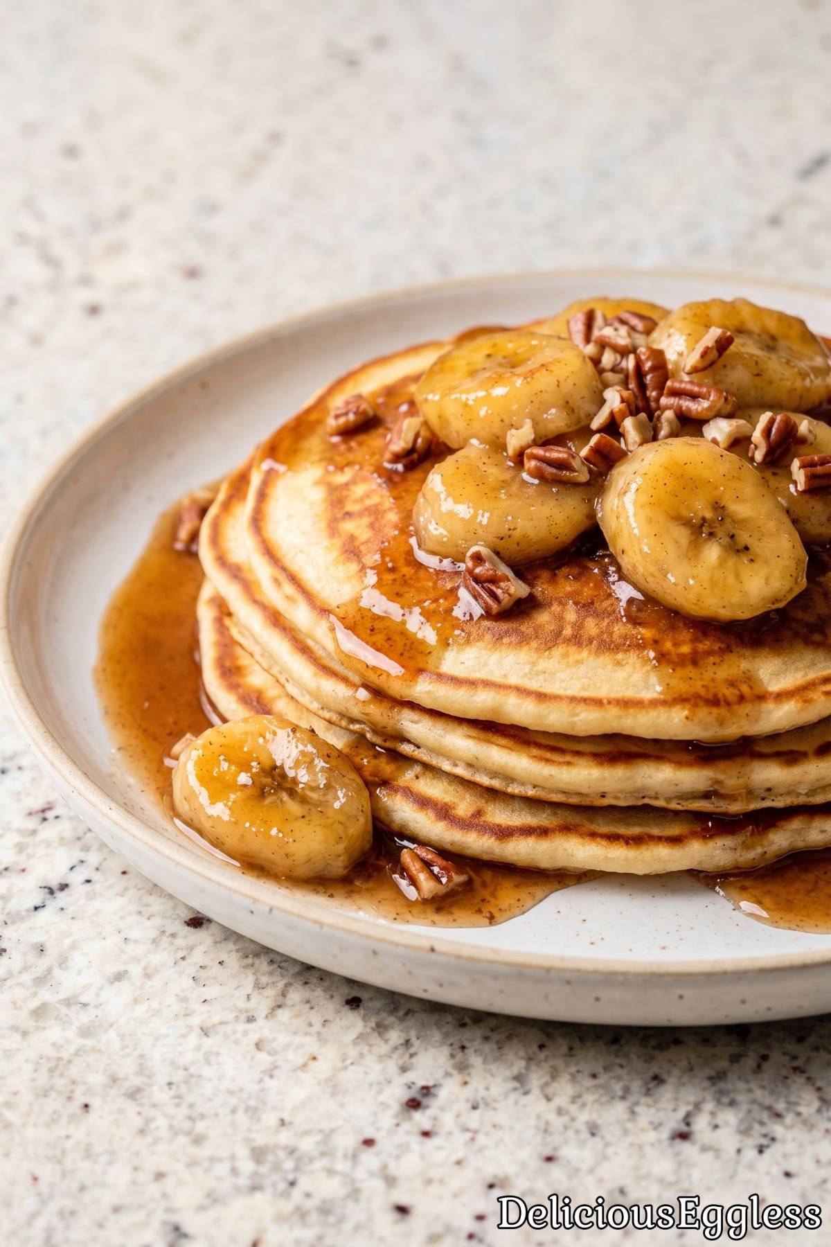 Golden stack of eggless banana pancakes