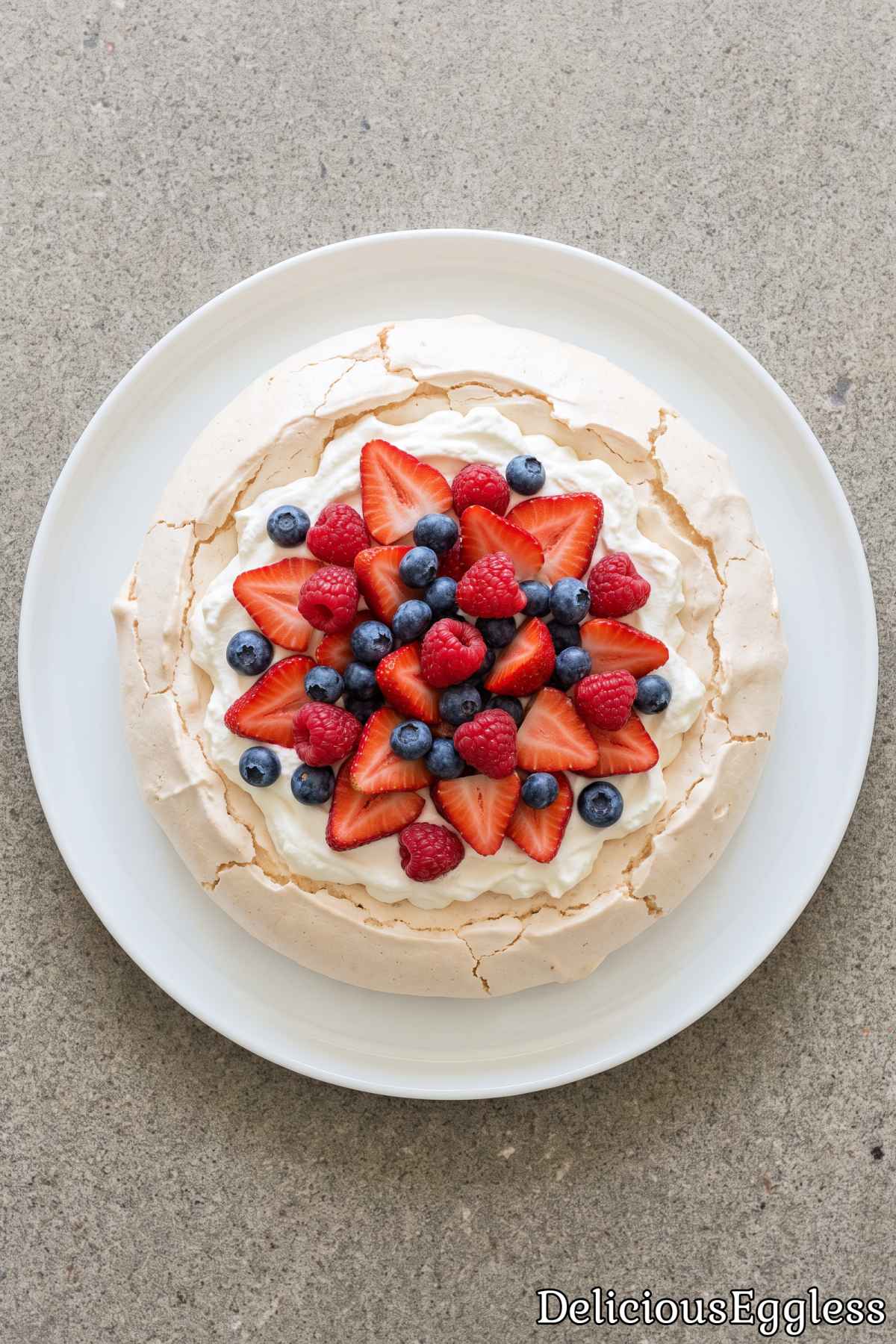 Light eggless berry pavlova dessert