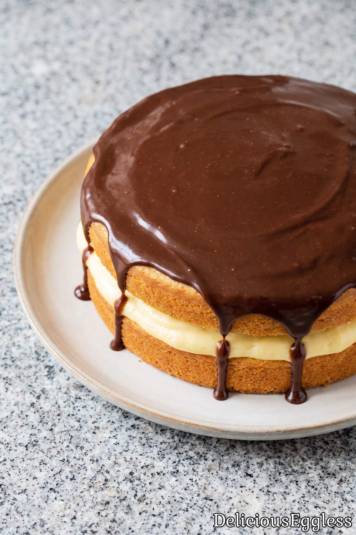 Eggless Boston cream pie with smooth cream.