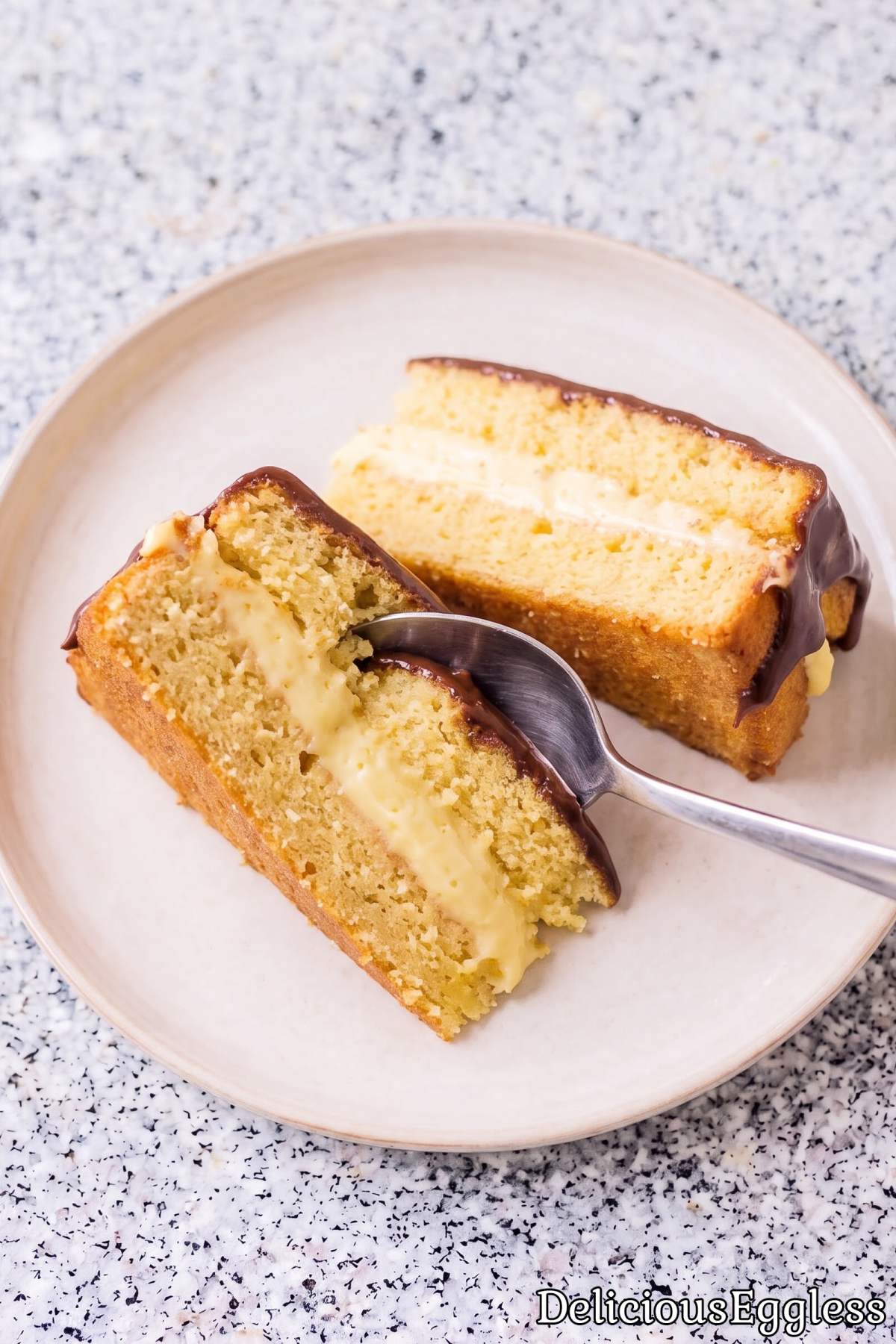 Tasty eggless Boston cream pie cake slice.