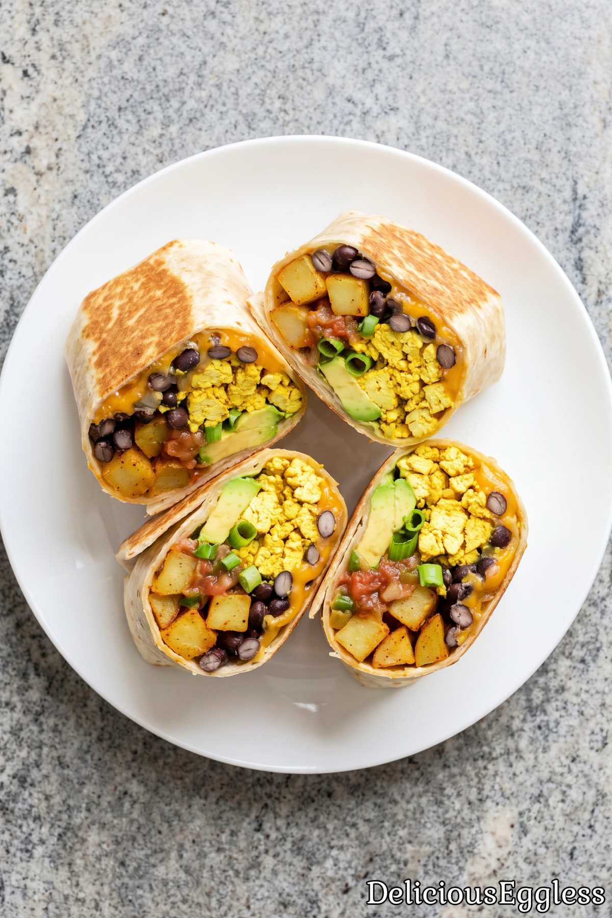 Warm eggless breakfast burrito cut in half
