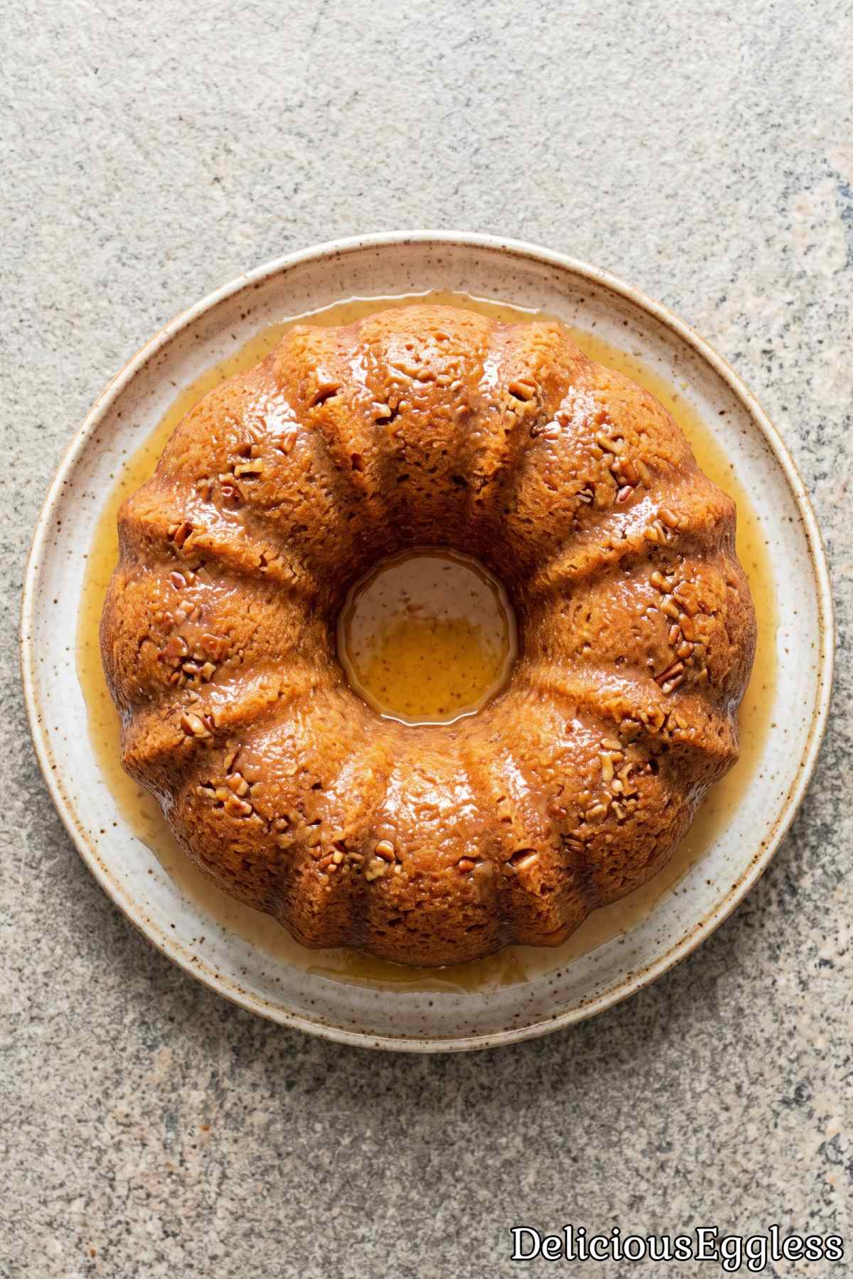Tender eggless rum cake with butter glaze