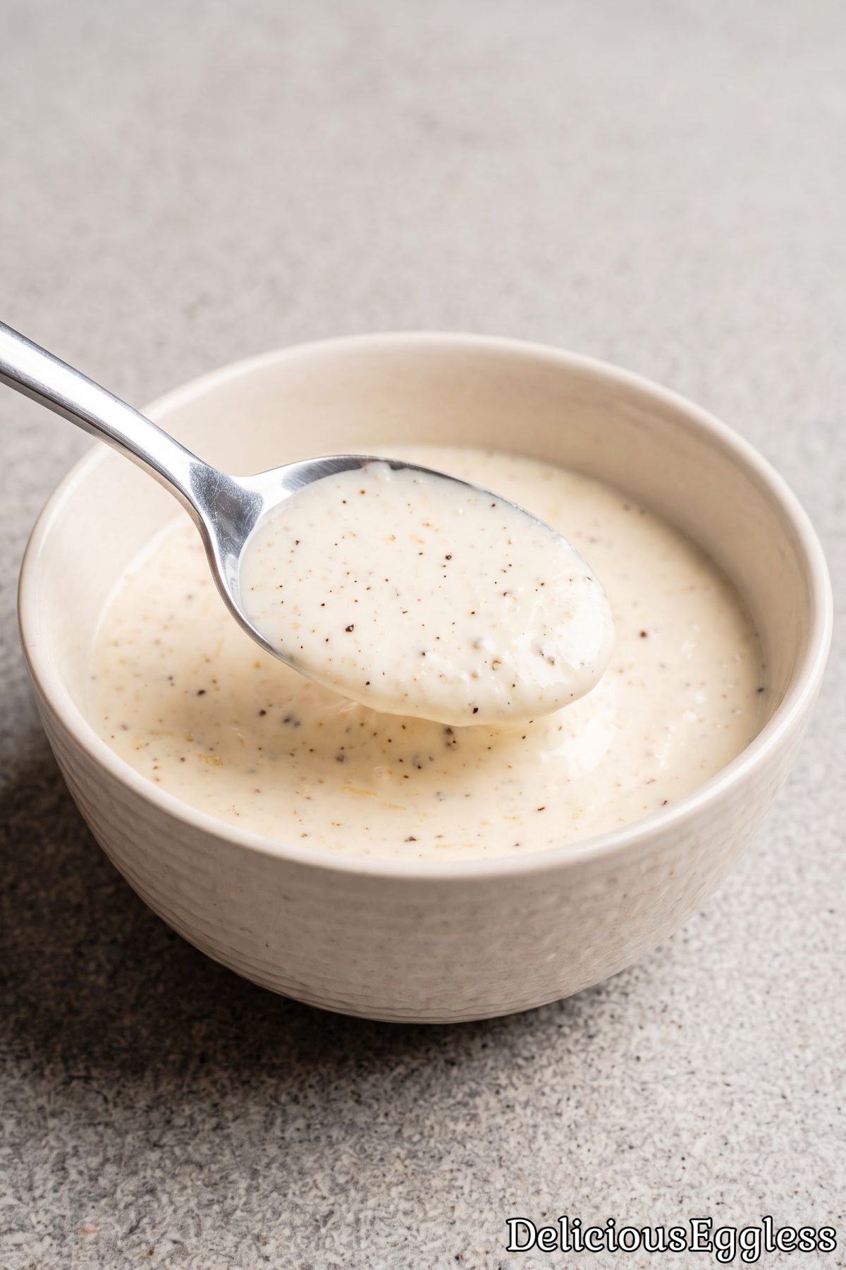 Bowl of savory egg free Caesar dressing