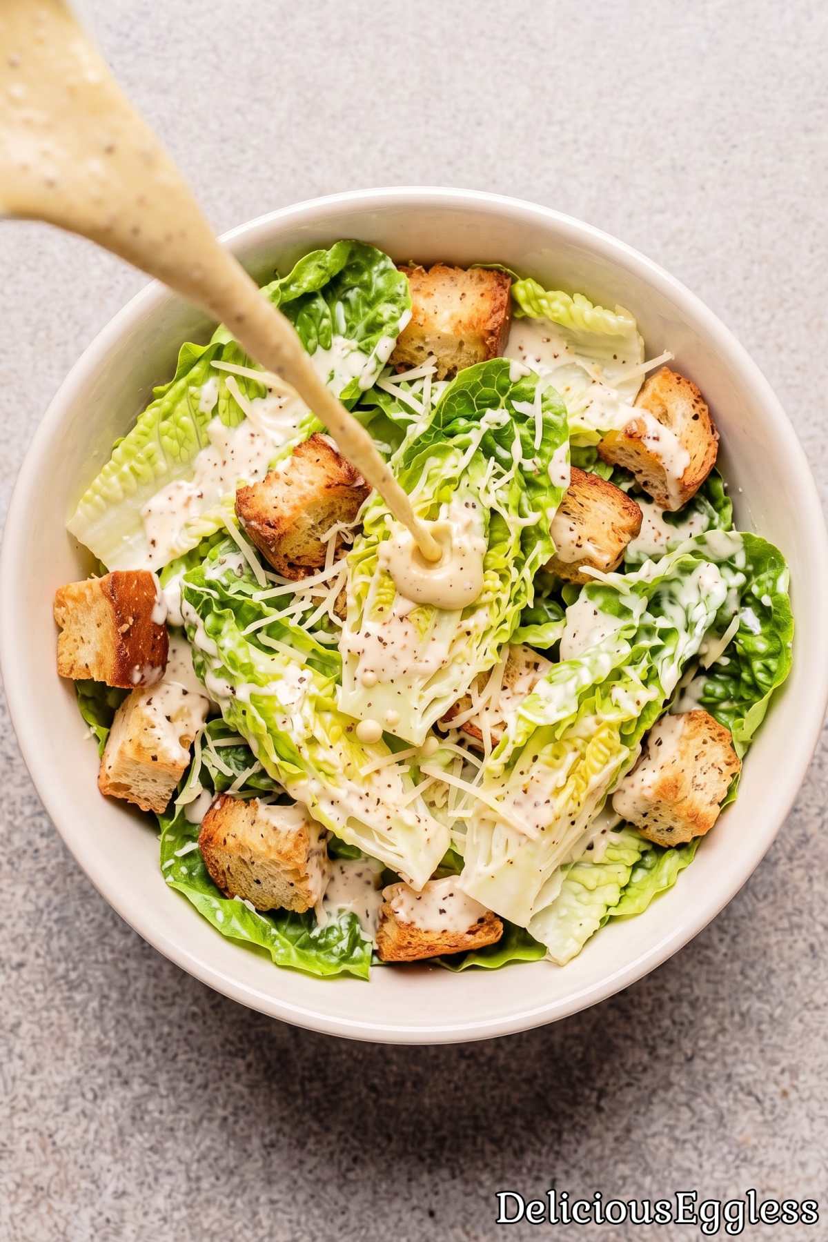 Creamy eggless Caesar dressing in a bowl