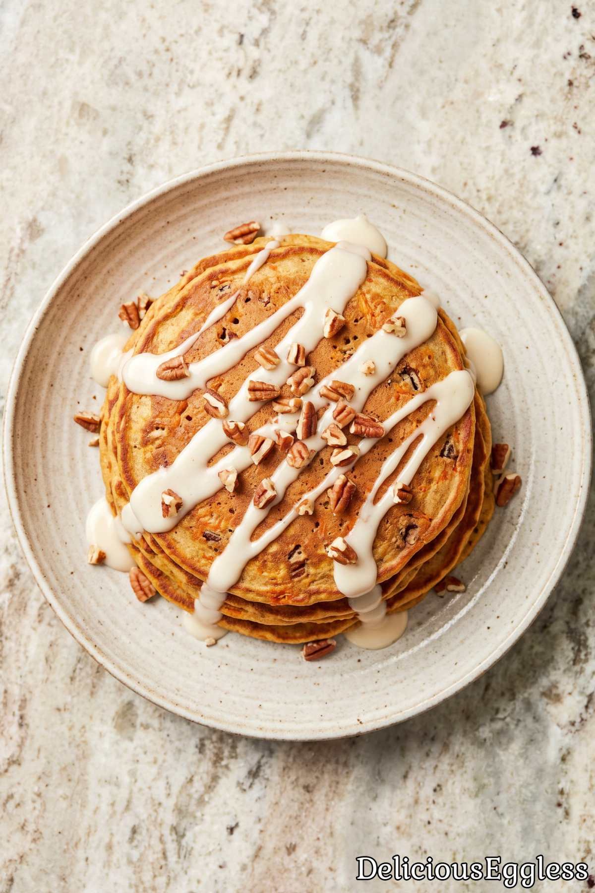 Soft eggless carrot cake pancakes on a plate