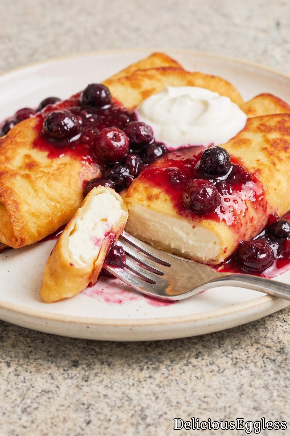 Golden eggless cheese blintzes