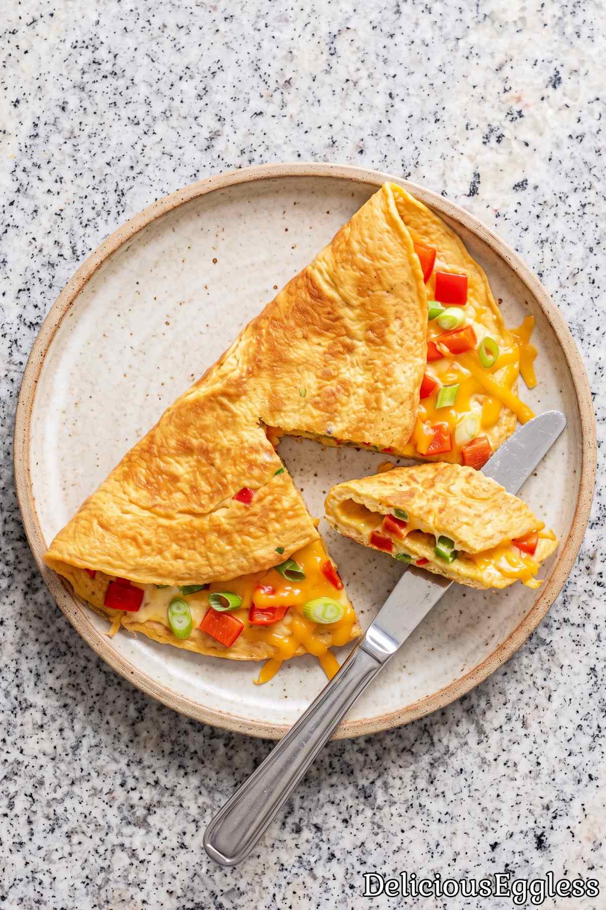 Melted cheese inside a folded eggless omelet