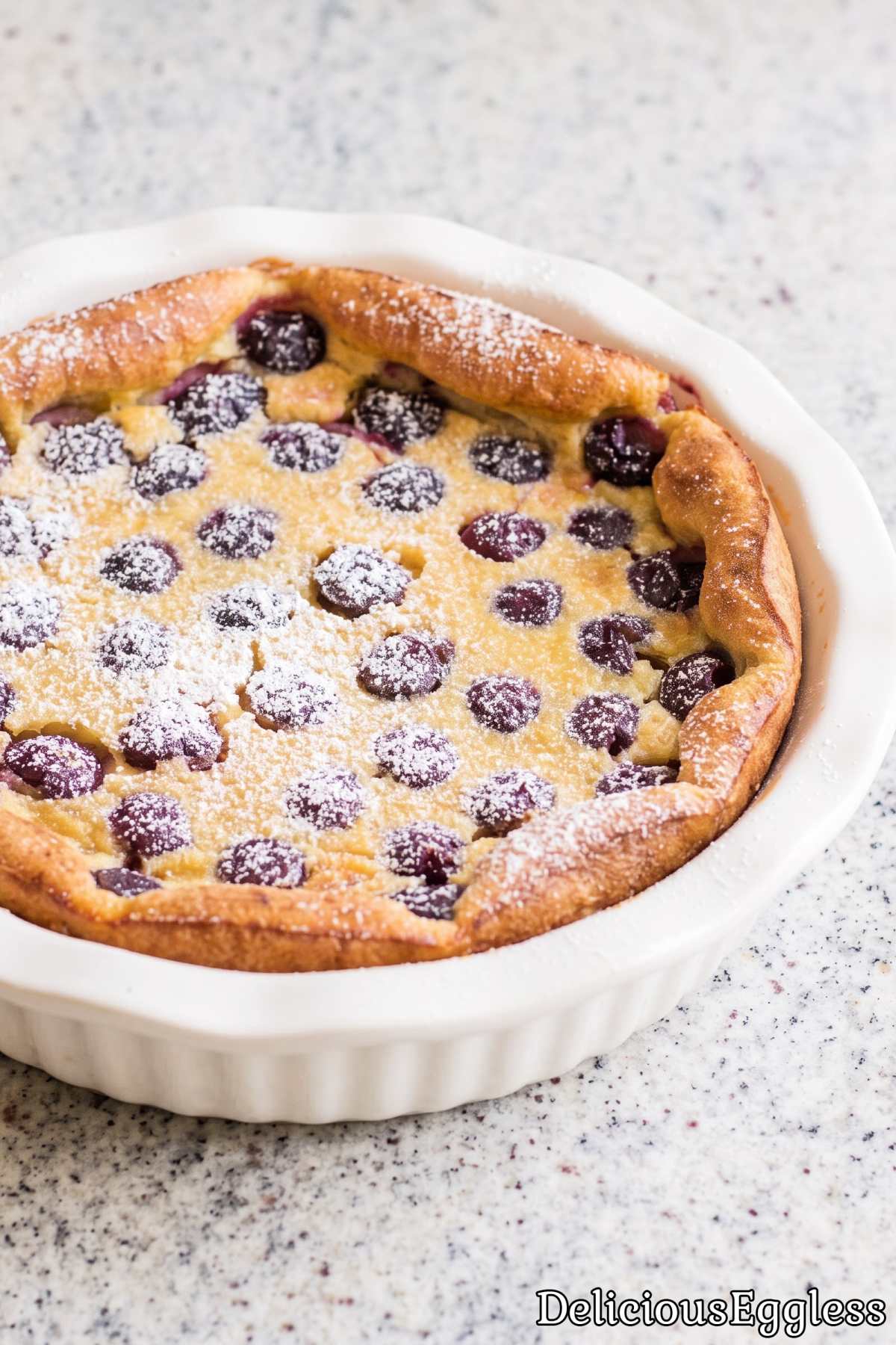 Easy eggless cherry clafoutis in baking dish