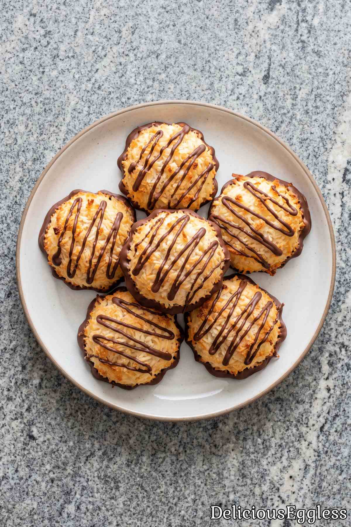 Simple eggless coconut macaroons on tray.