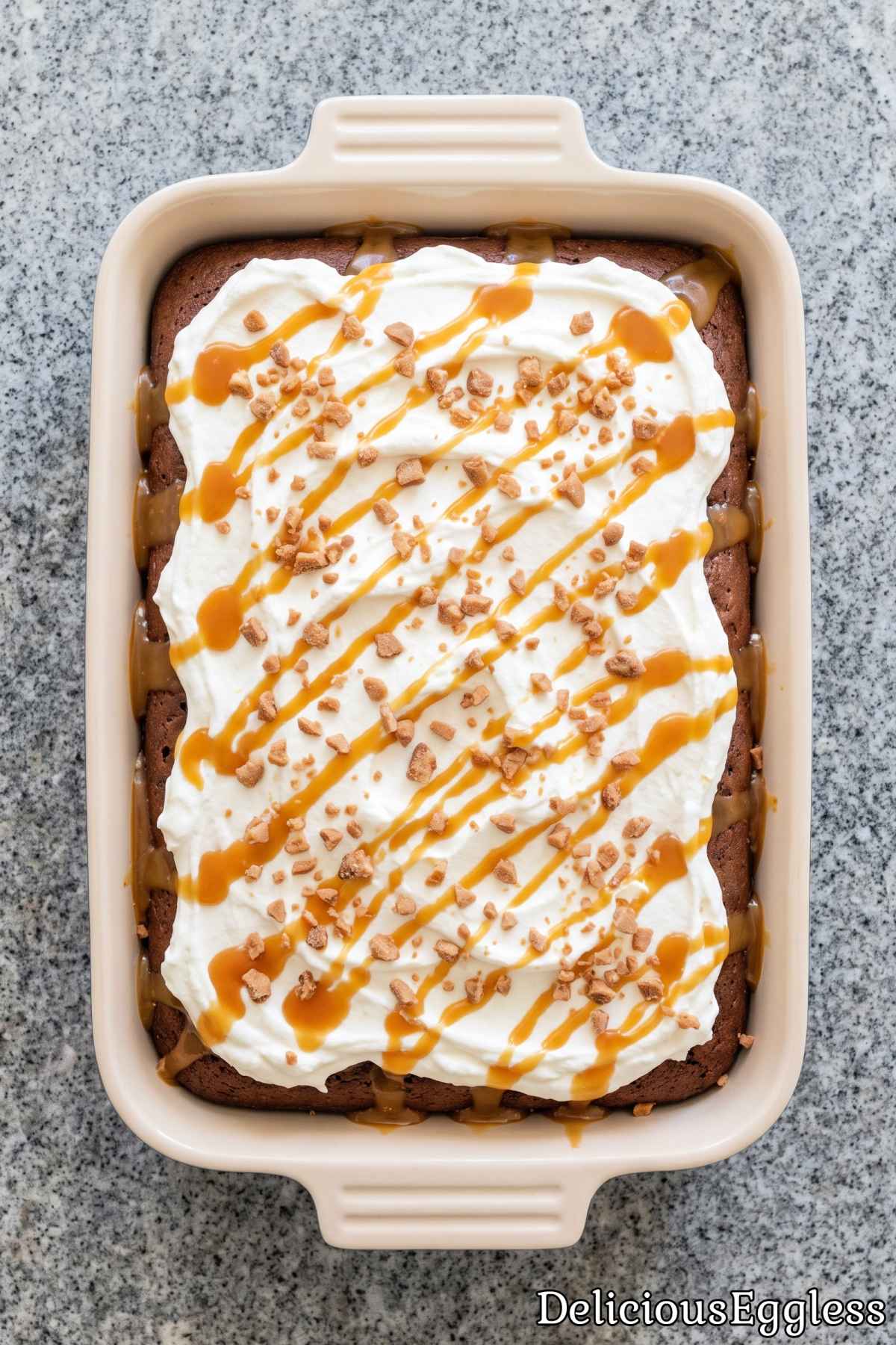 Rich chocolate caramel poke cake with cream