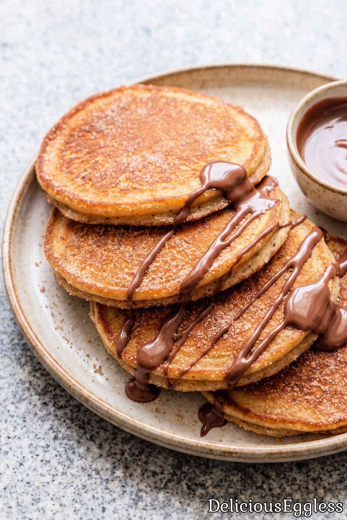 Fluffy eggless churro pancakes with cinnamon