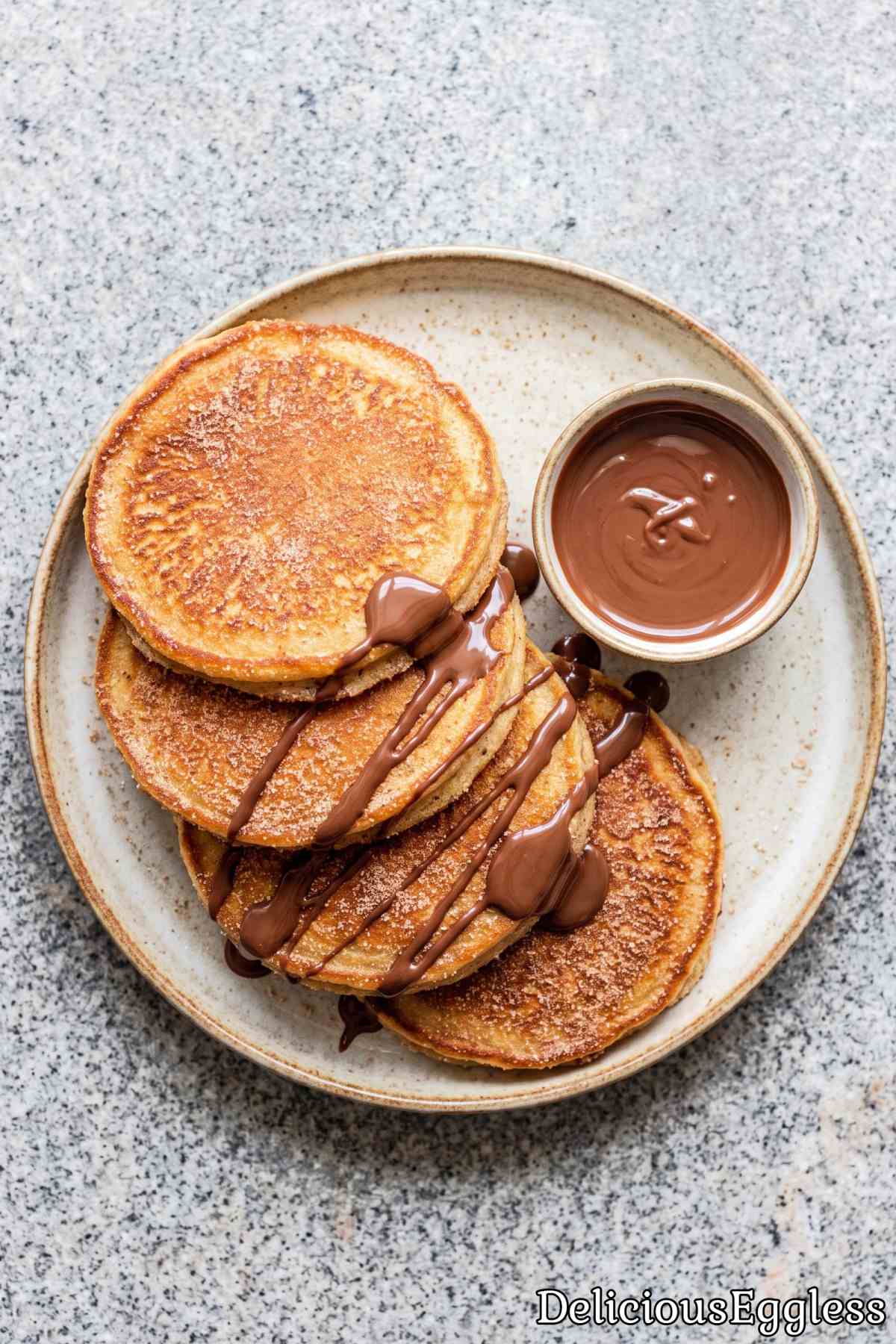 Golden crispy eggless churro pancakes