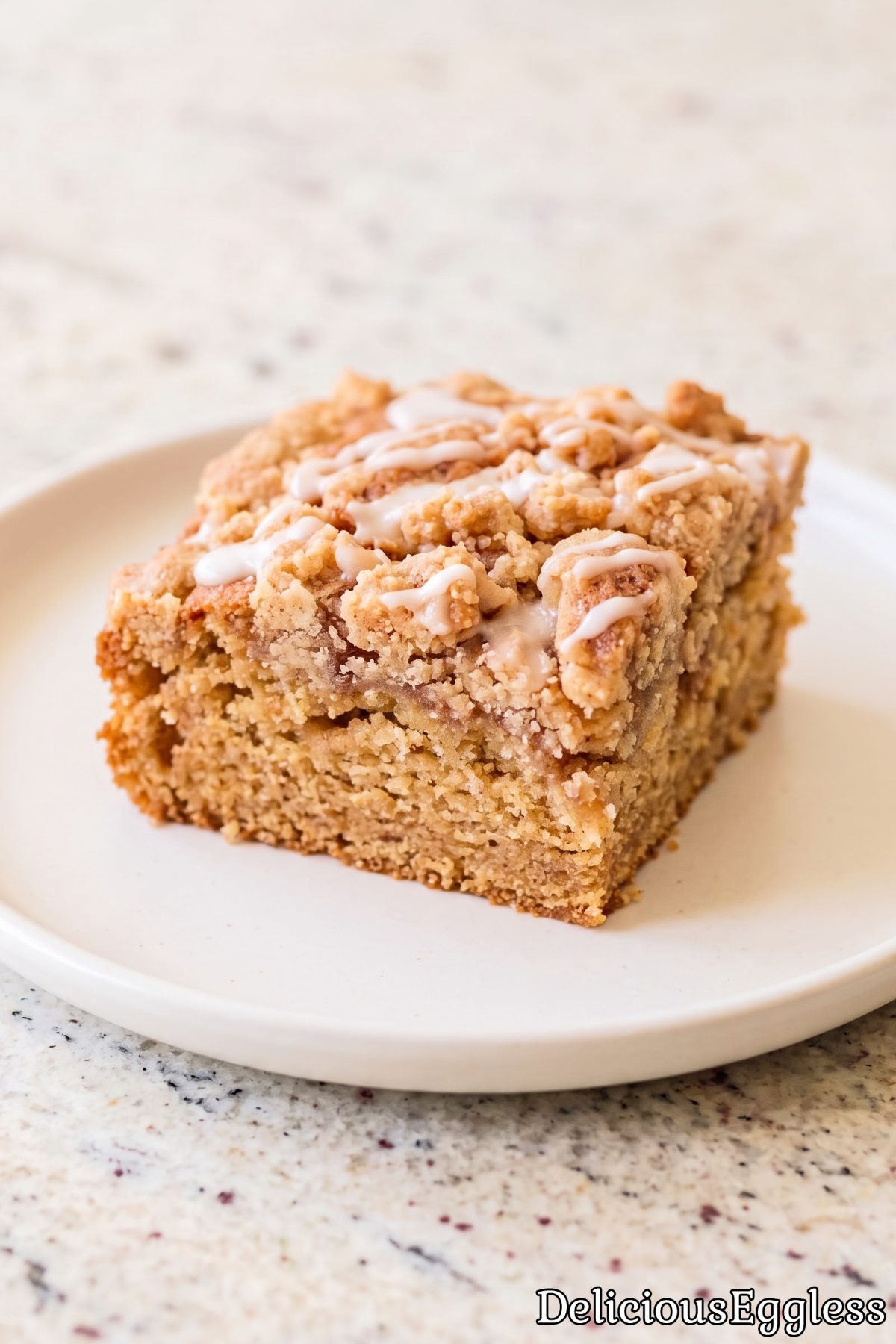 Warm slice of eggless cinnamon coffee cake