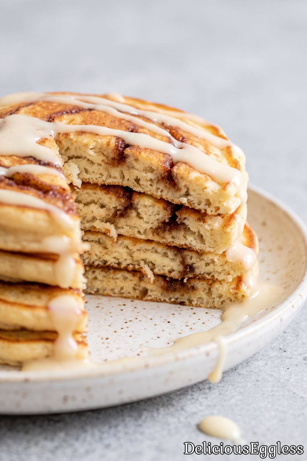 Warm eggless cinnamon pancakes with icing