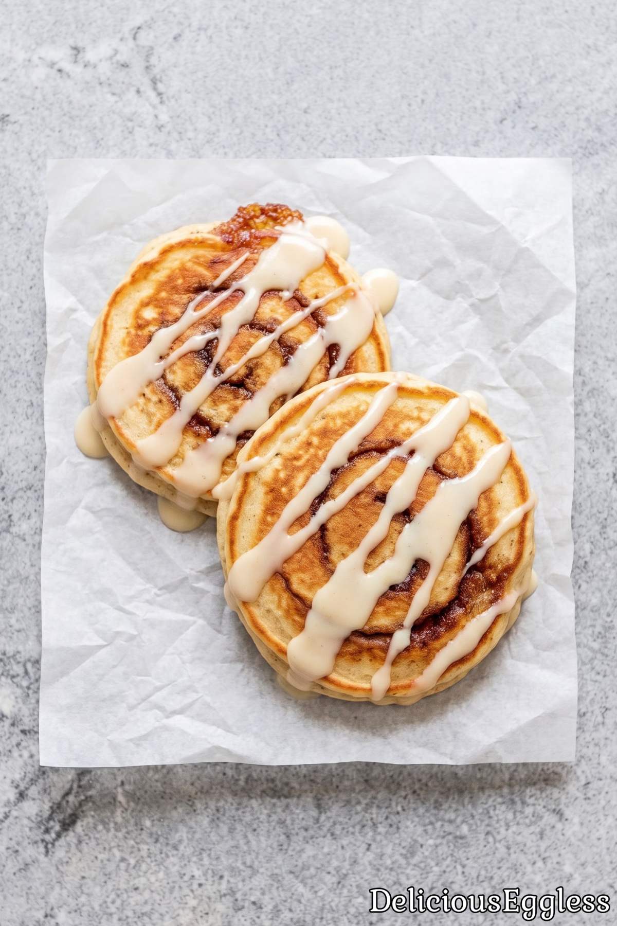 Eggless cinnamon roll pancakes with sweet glaze