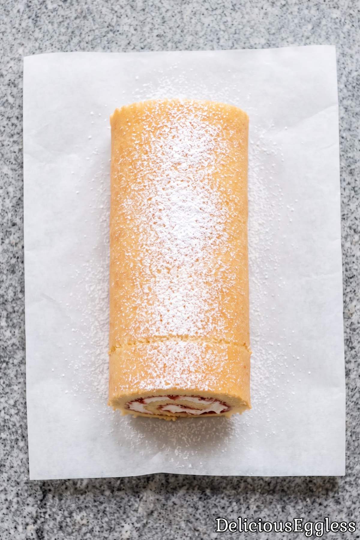 Eggless vanilla Swiss roll cake slice