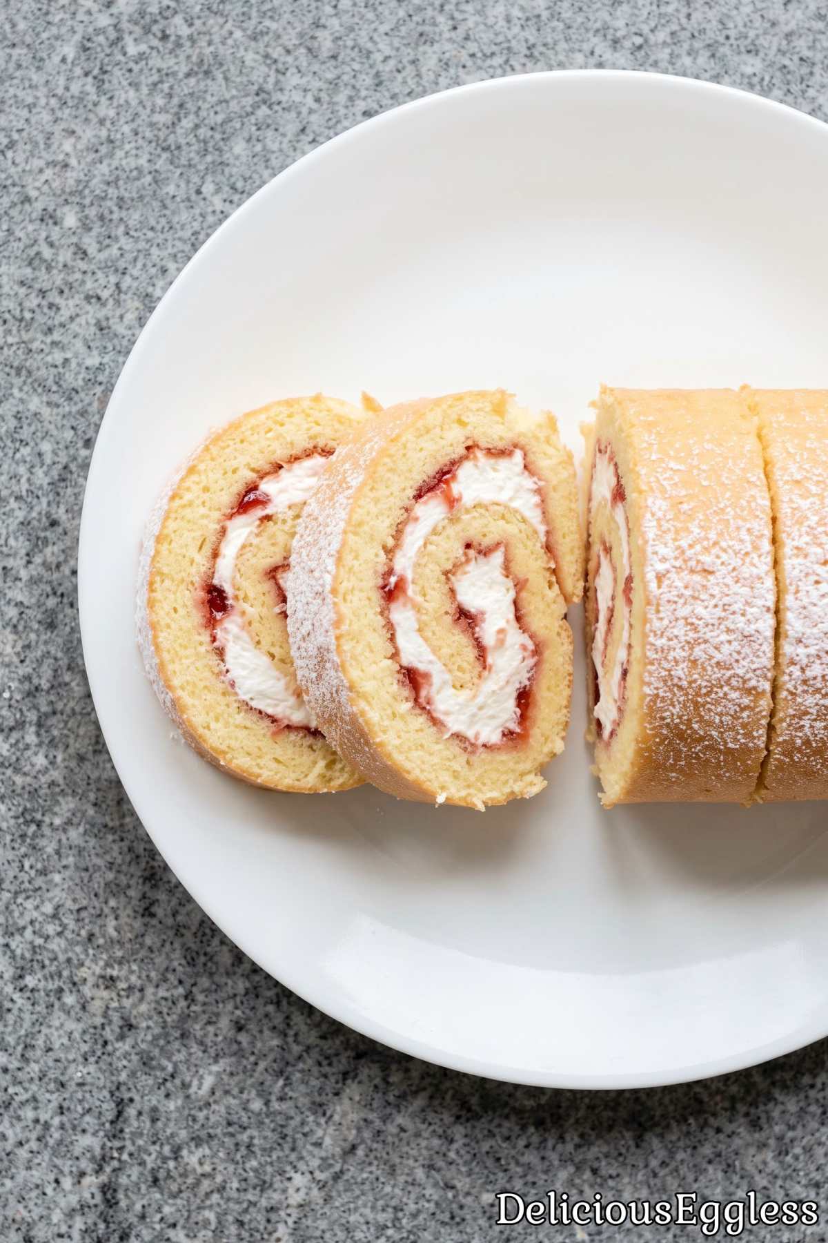 Eggless Swiss roll cake on a serving plate