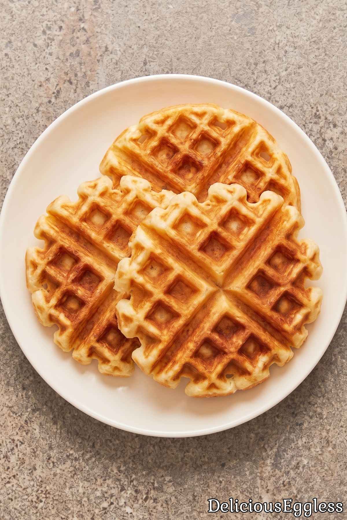 Crispy eggless Belgian waffles on a plate.