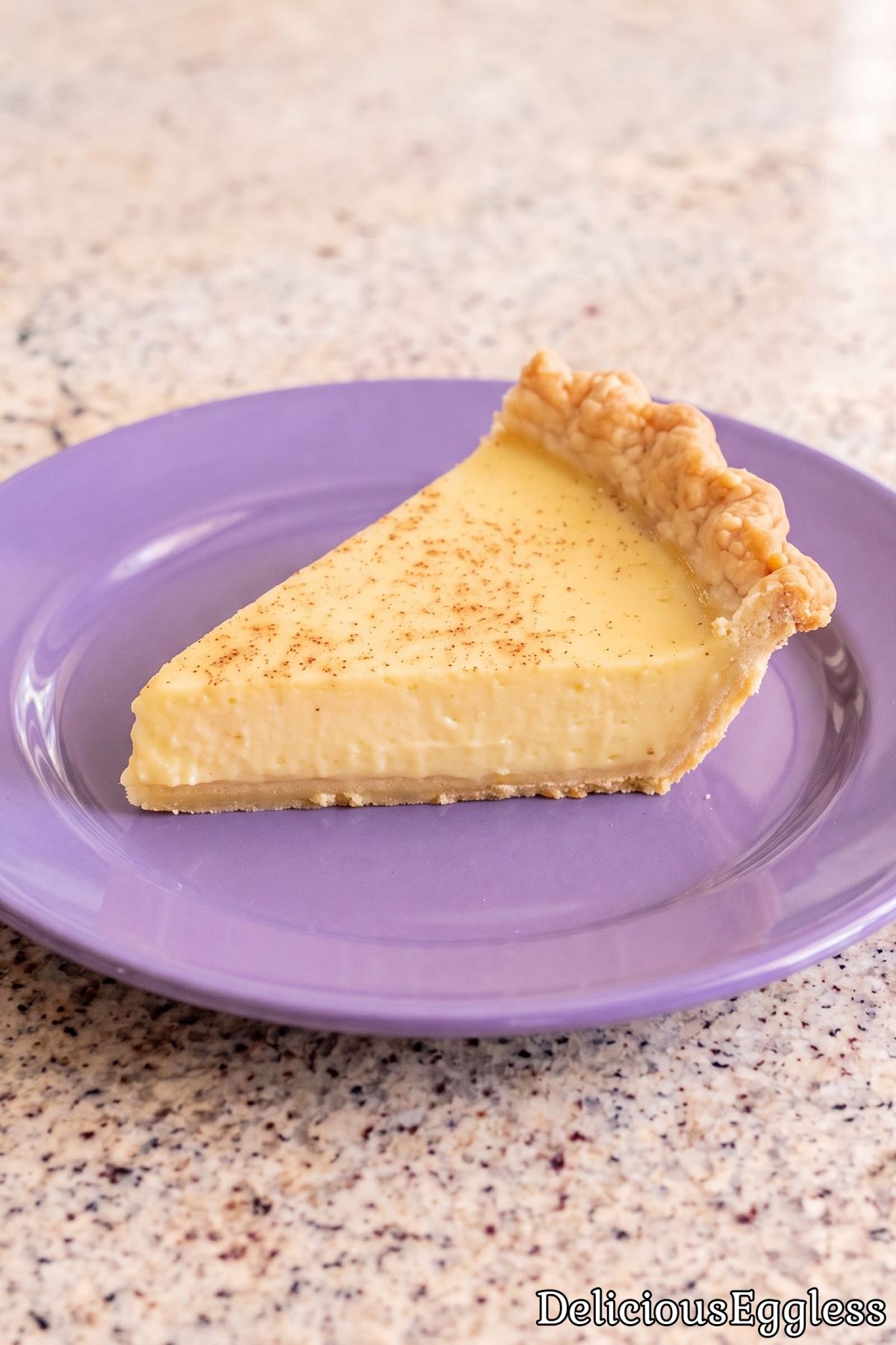 Soft and creamy eggless custard pie slice.
