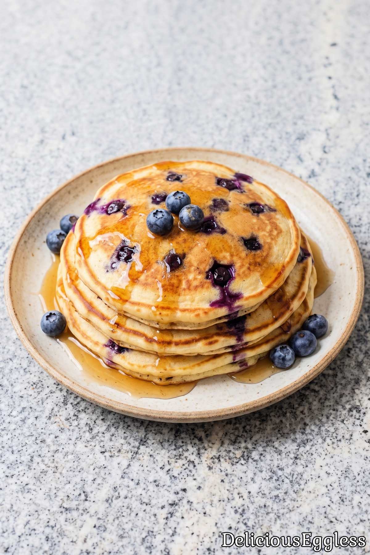 Stack of golden eggless blueberry pancakes