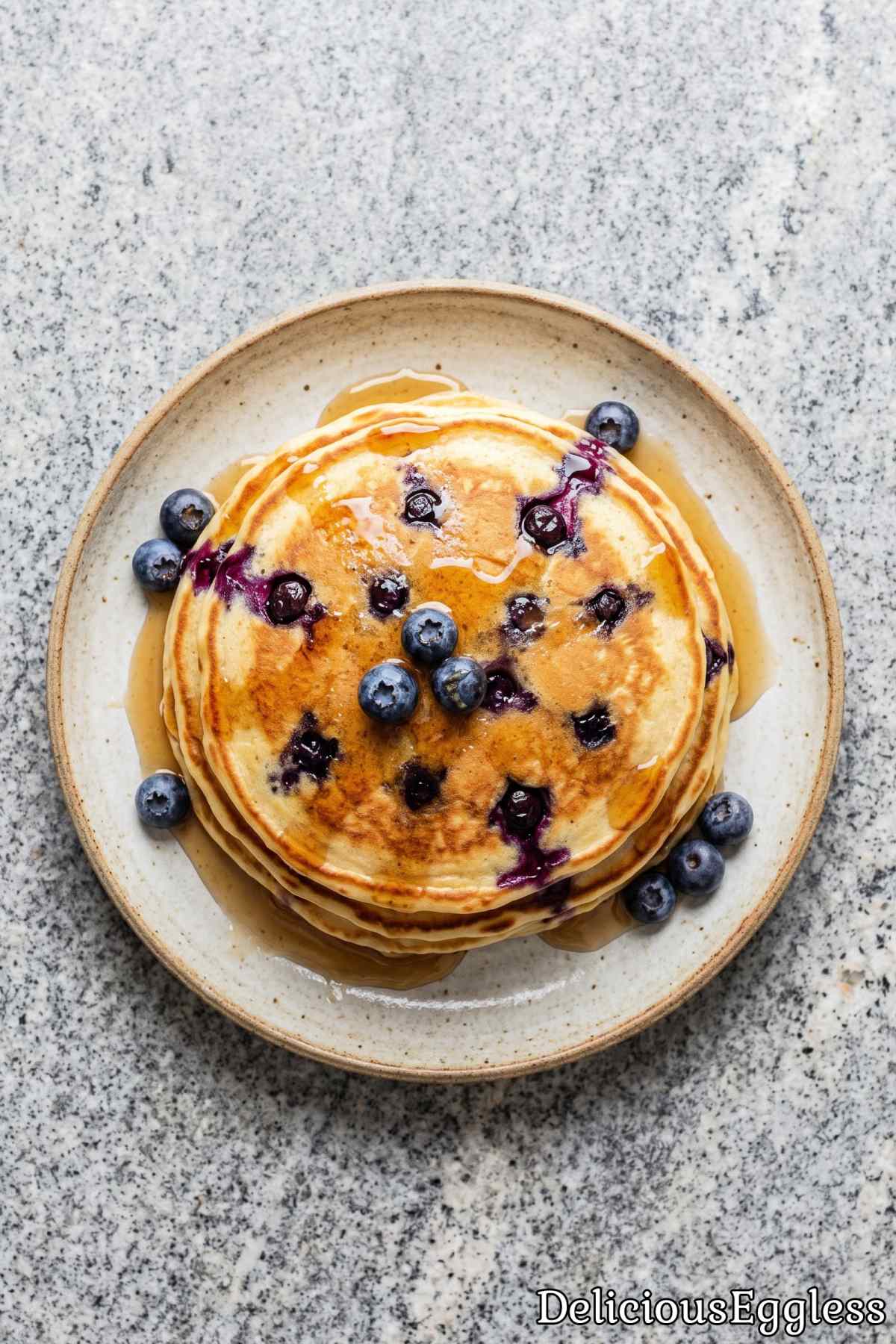 Fresh eggless blueberry pancakes on a plate