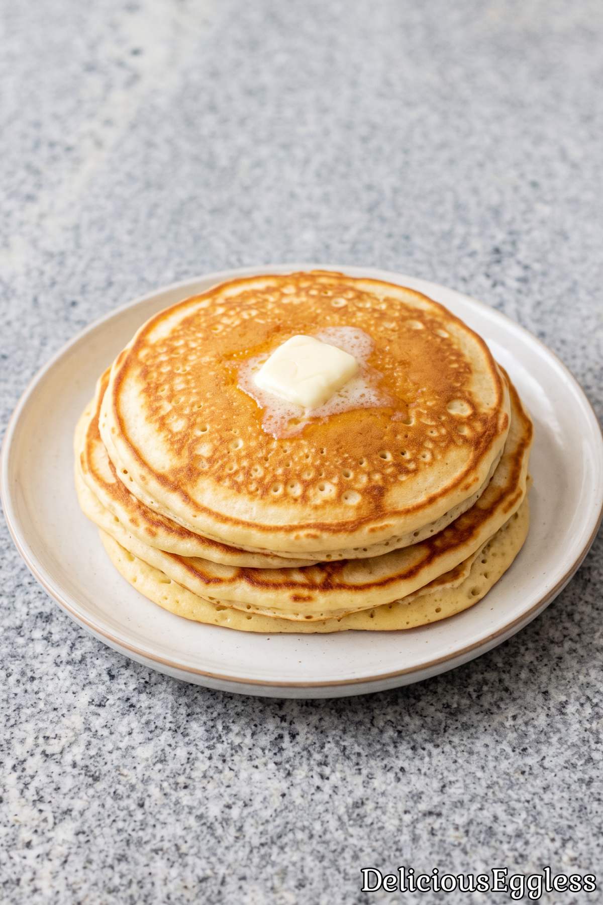 Golden fluffy eggless pancake stack