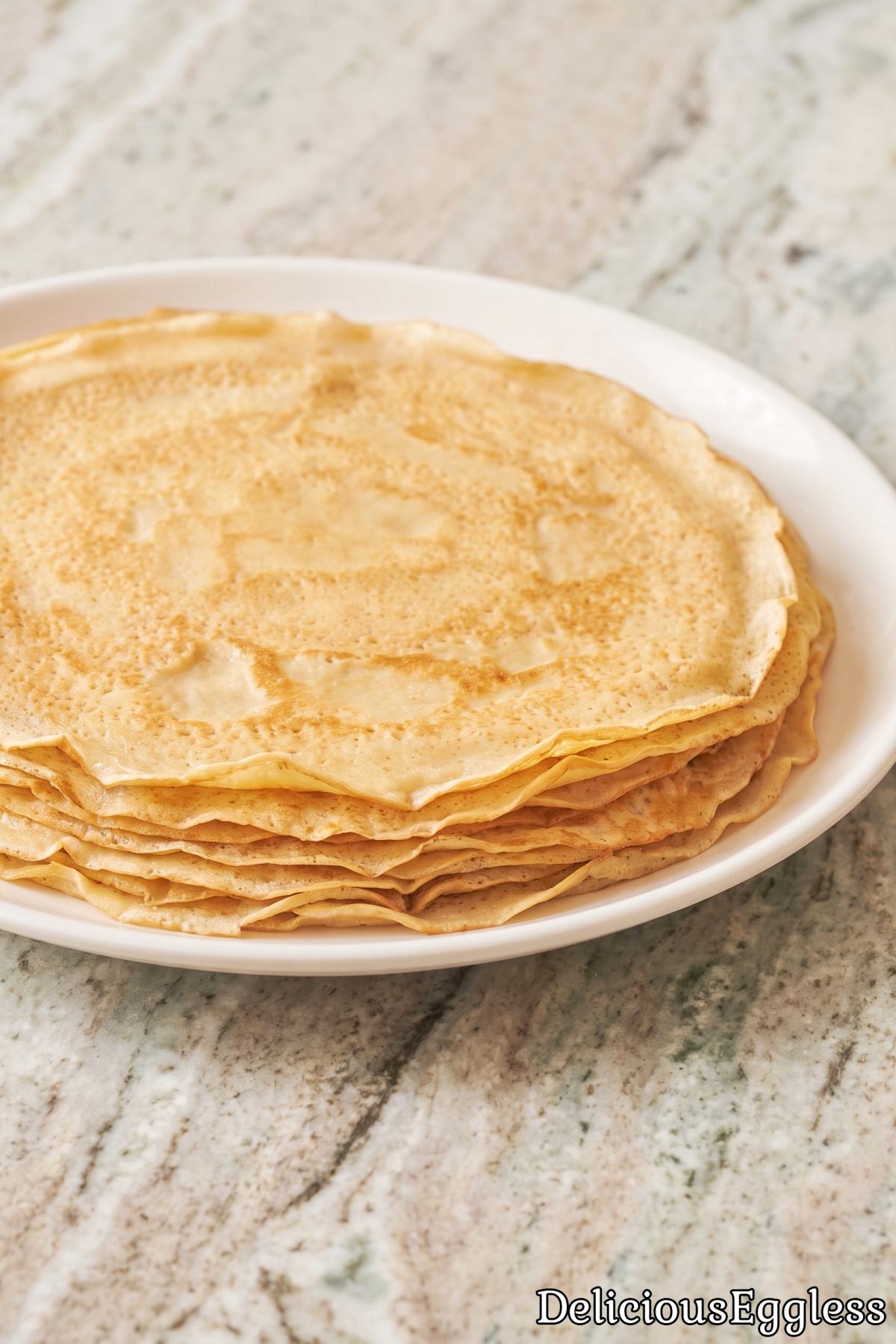 Golden eggless French crepes on a plate