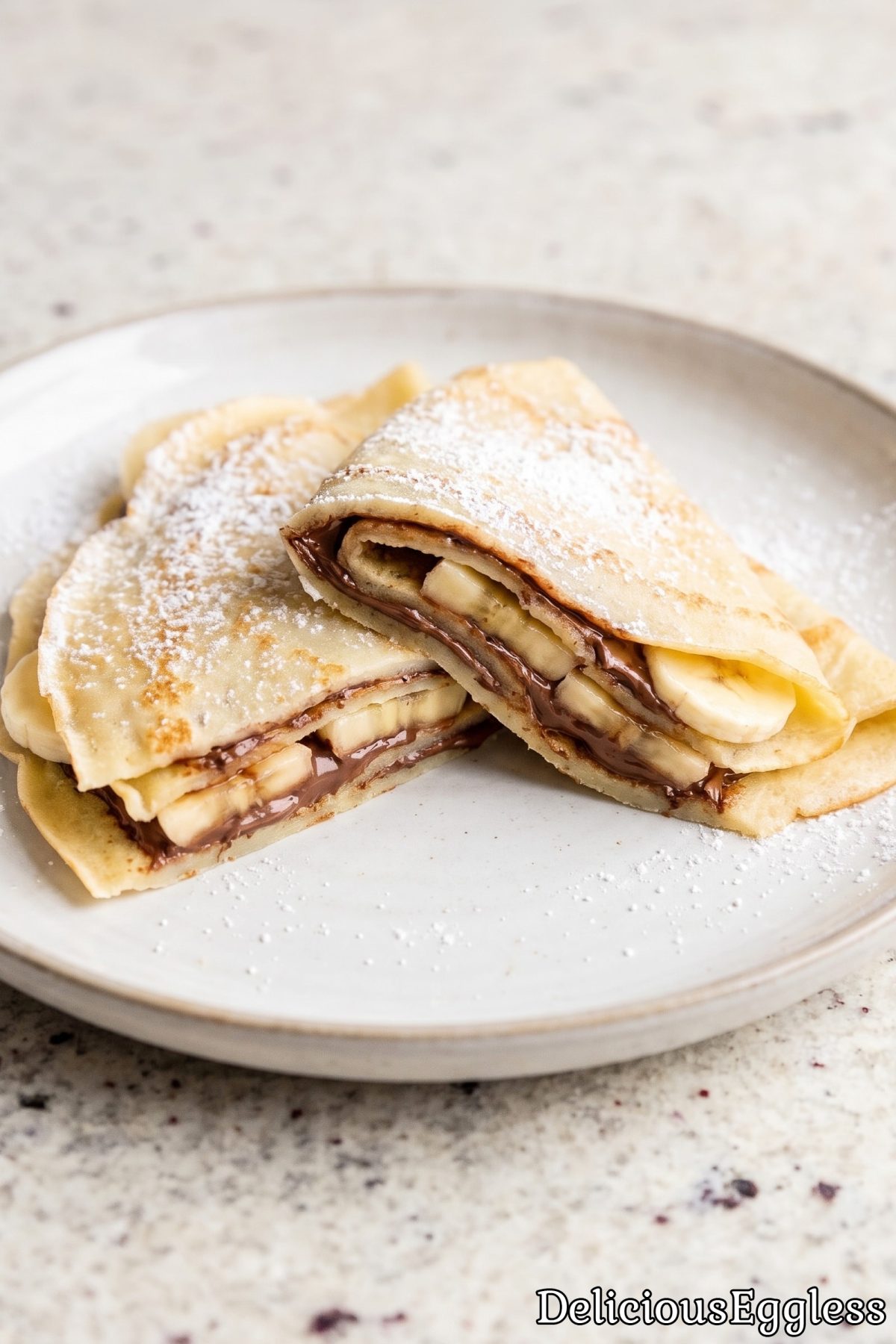 Stack of golden eggless French crepes