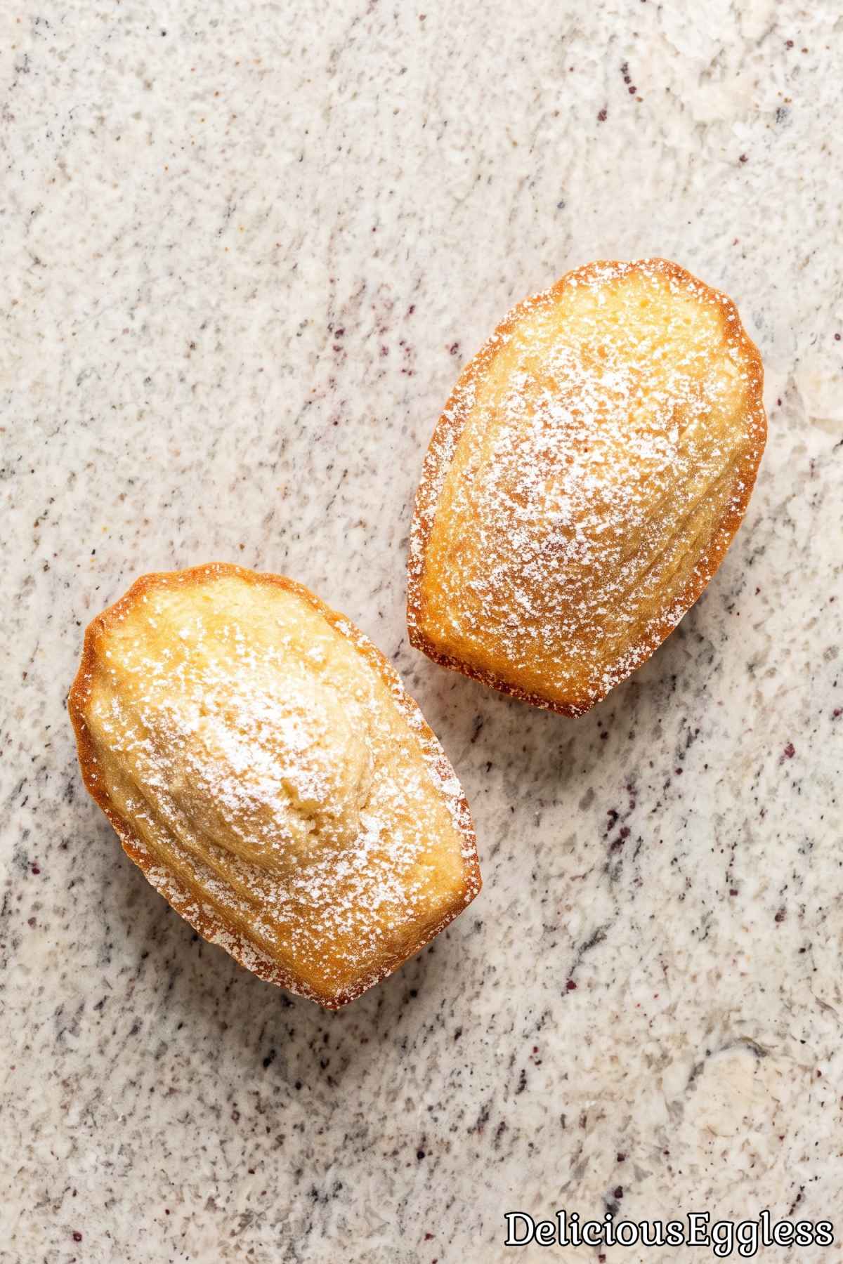 Warm eggless French madeleines on a plate