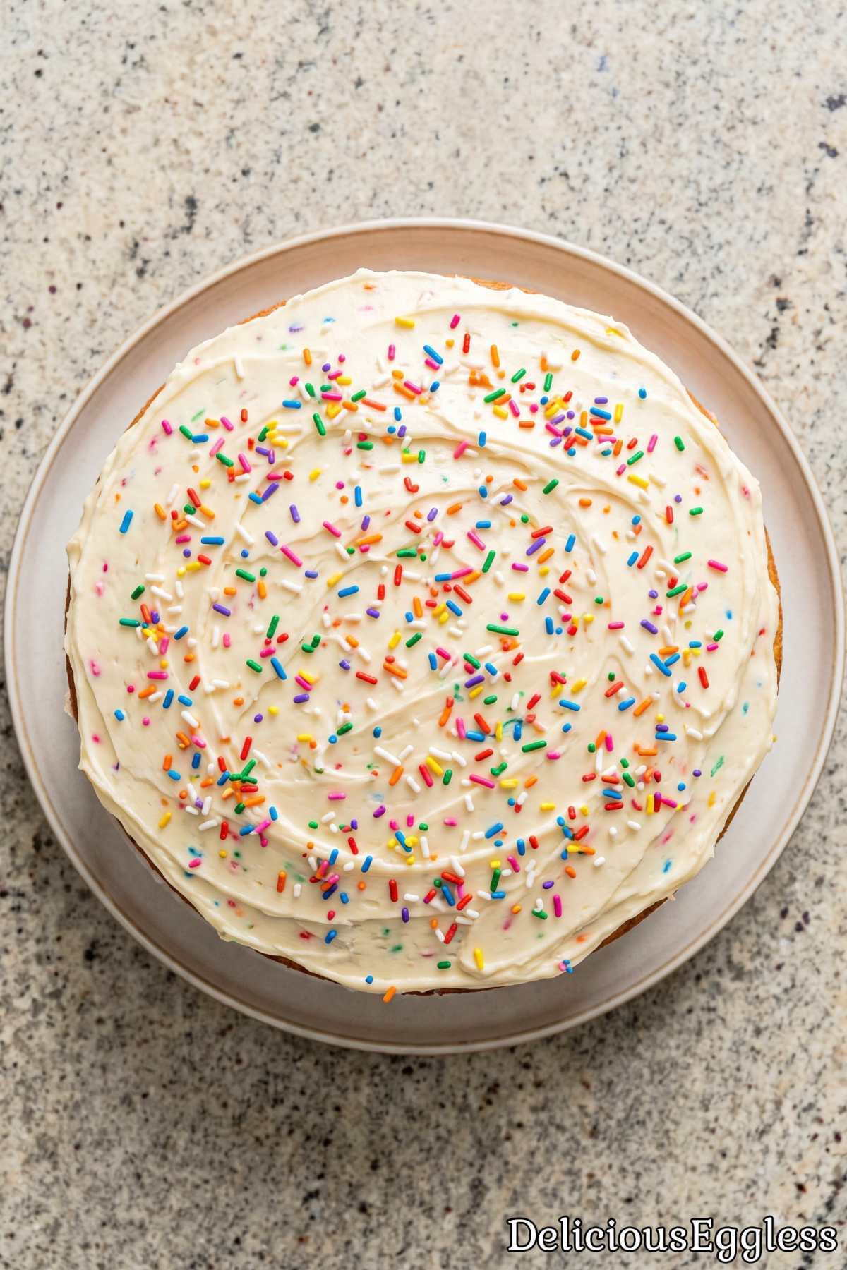 Fluffy eggless sprinkle layer cake