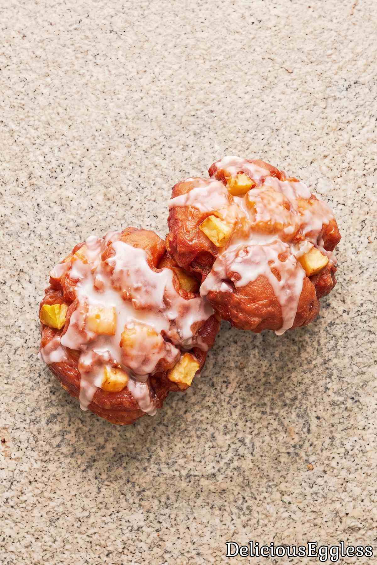 Soft and sweet eggless glazed apple fritters