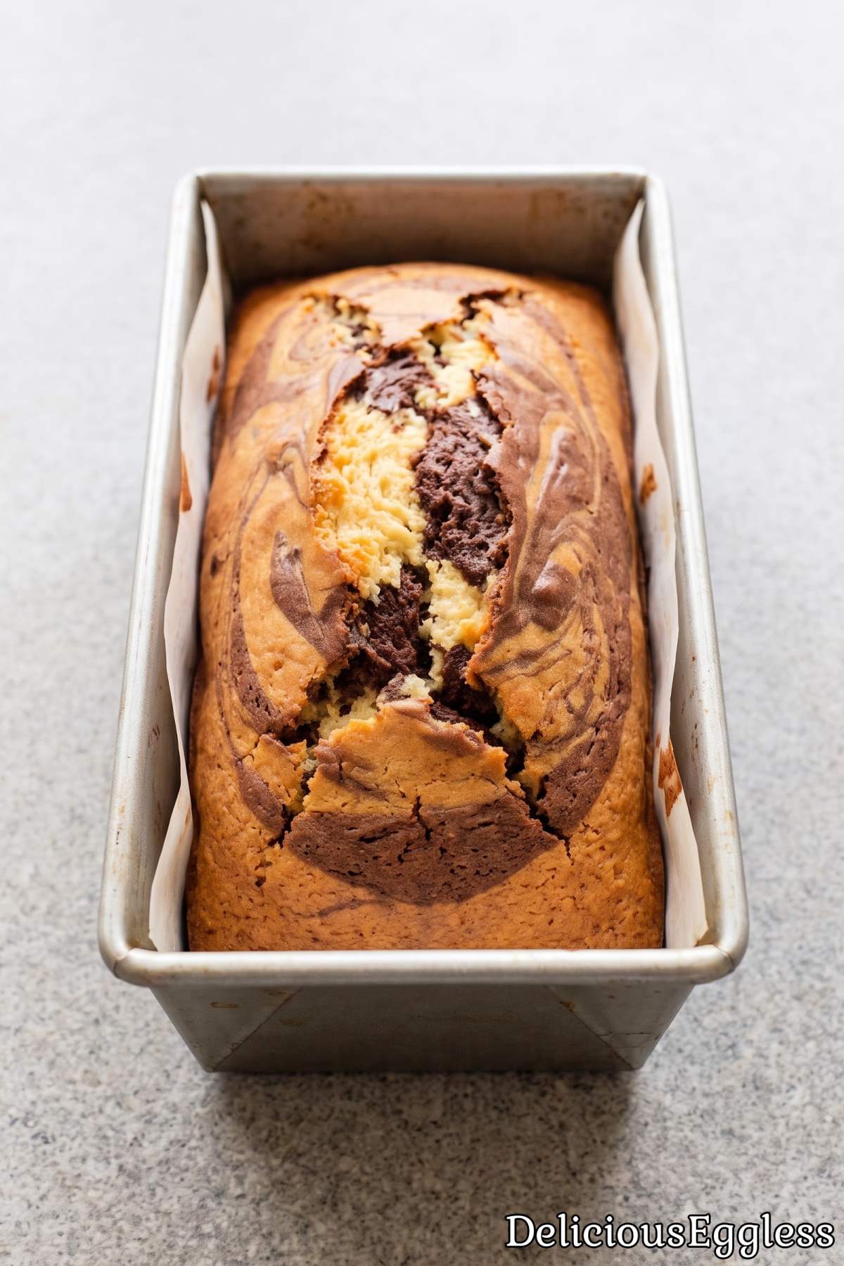Classic eggless marble cake loaf recipe.