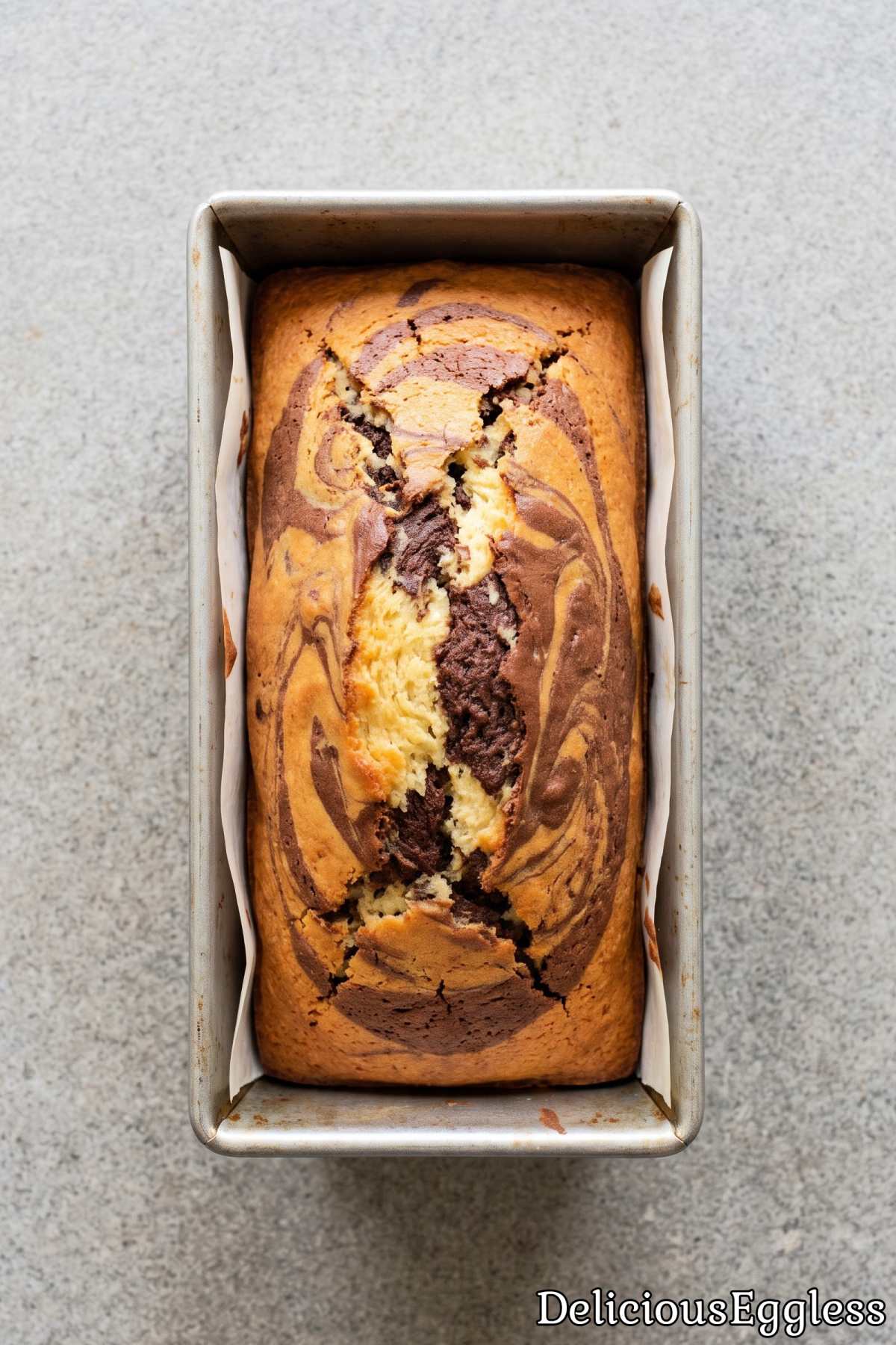 Soft and fluffy eggless marble loaf cake.