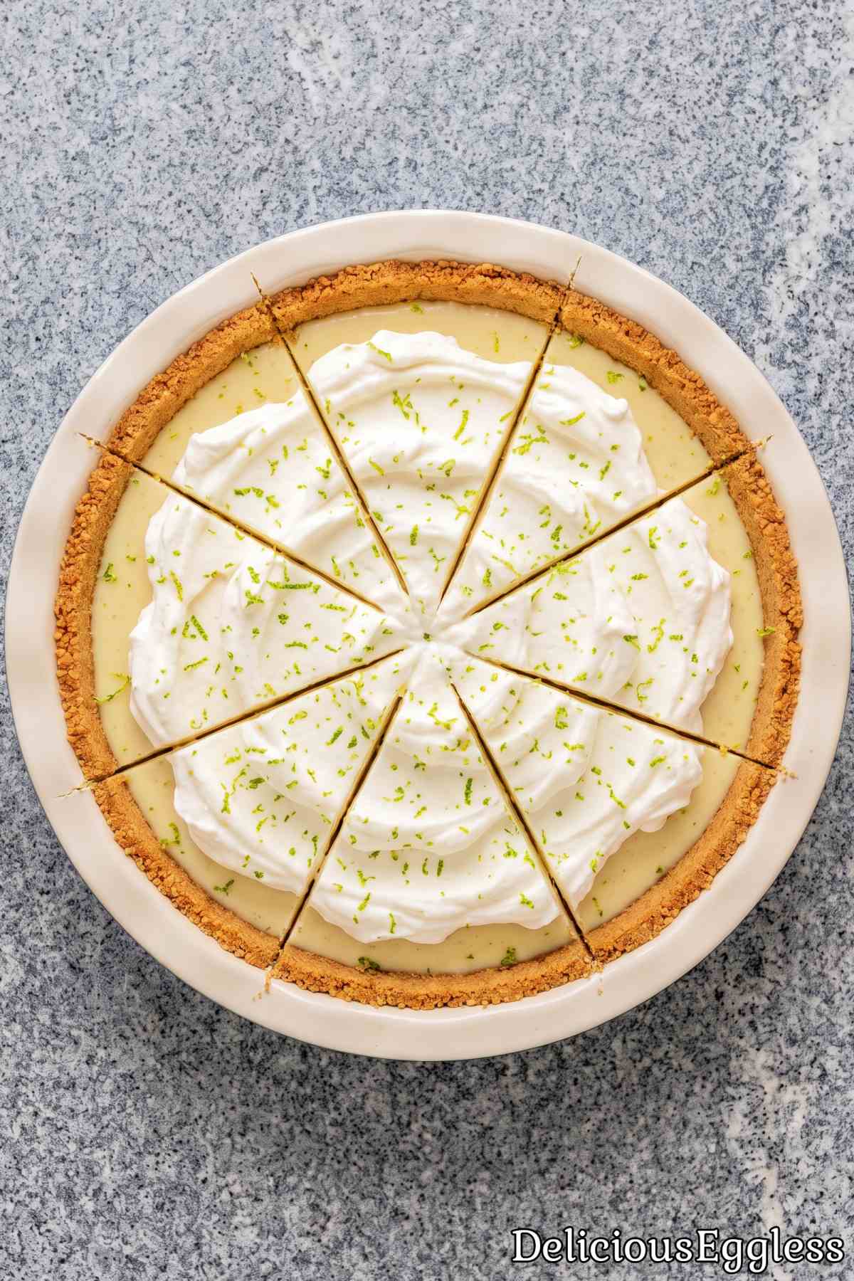 Chilled no bake key lime pie slice on a board.