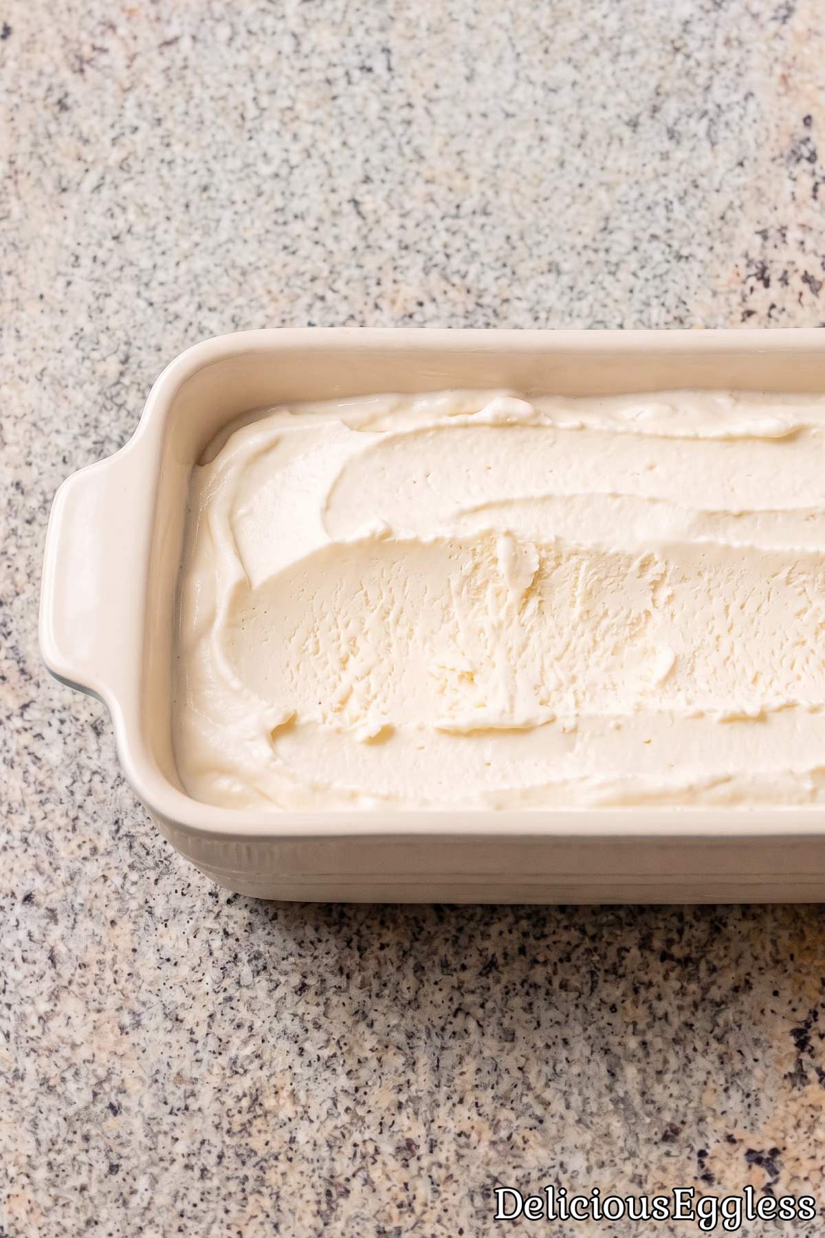 Smooth scoop of eggless vanilla ice cream