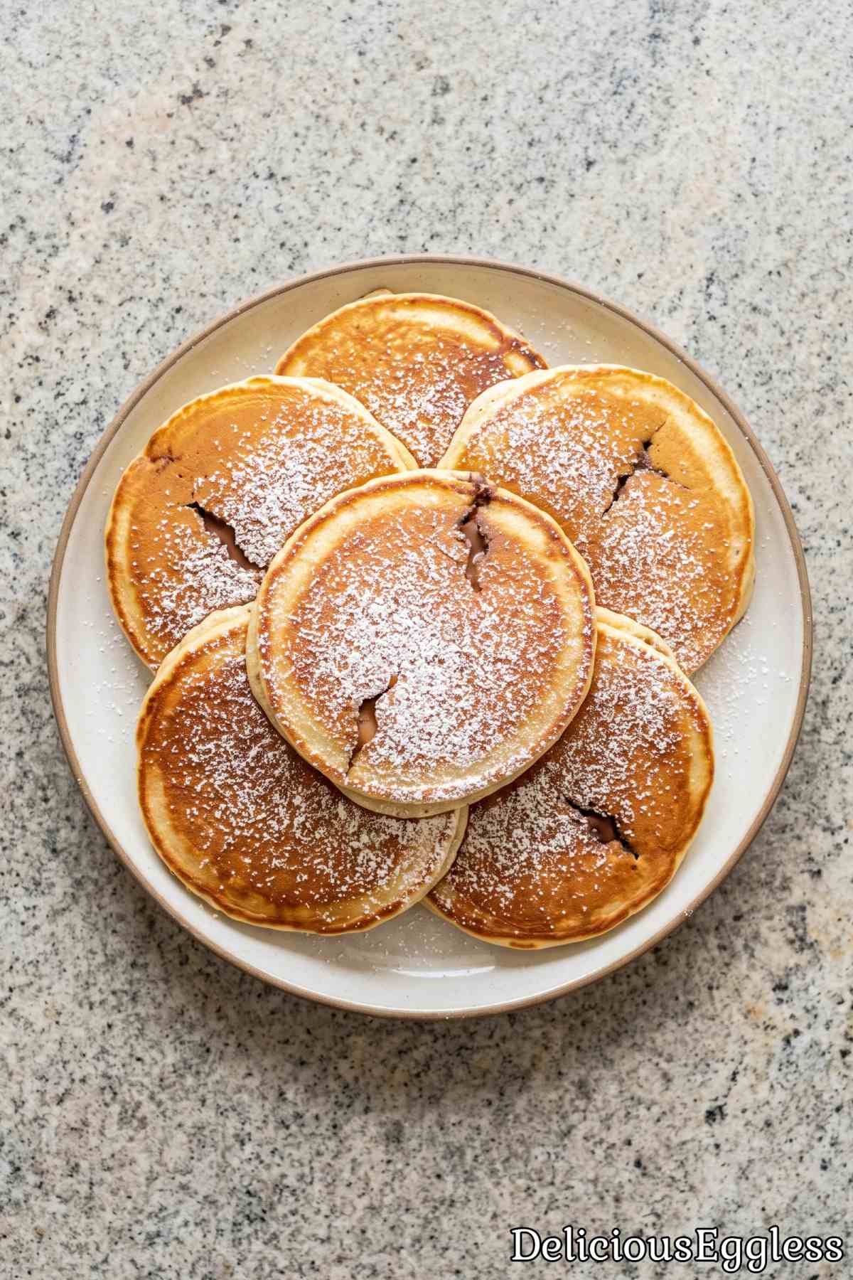 Soft eggless pancakes with gooey Nutella
