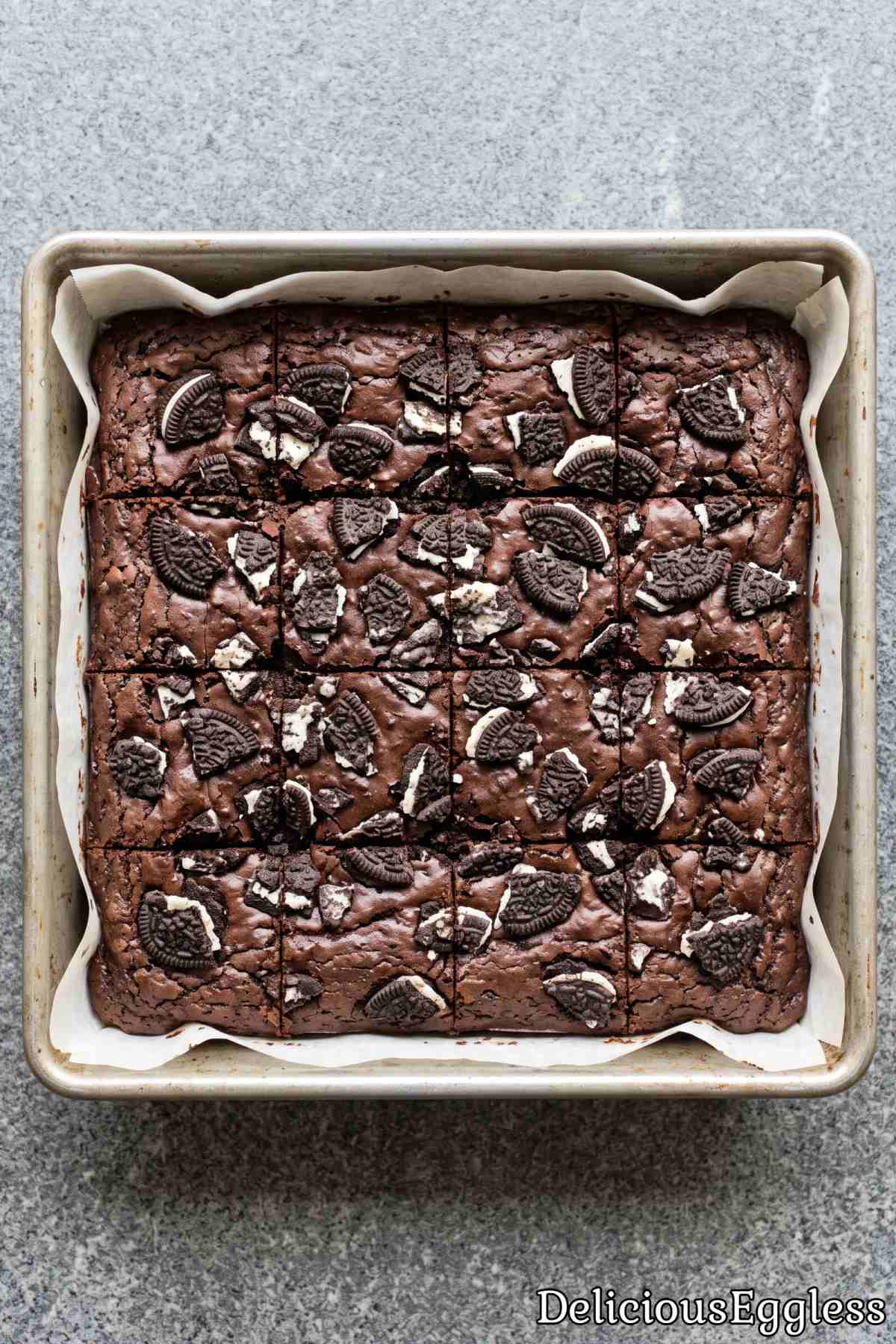 Thick eggless brownies topped with crushed Oreos