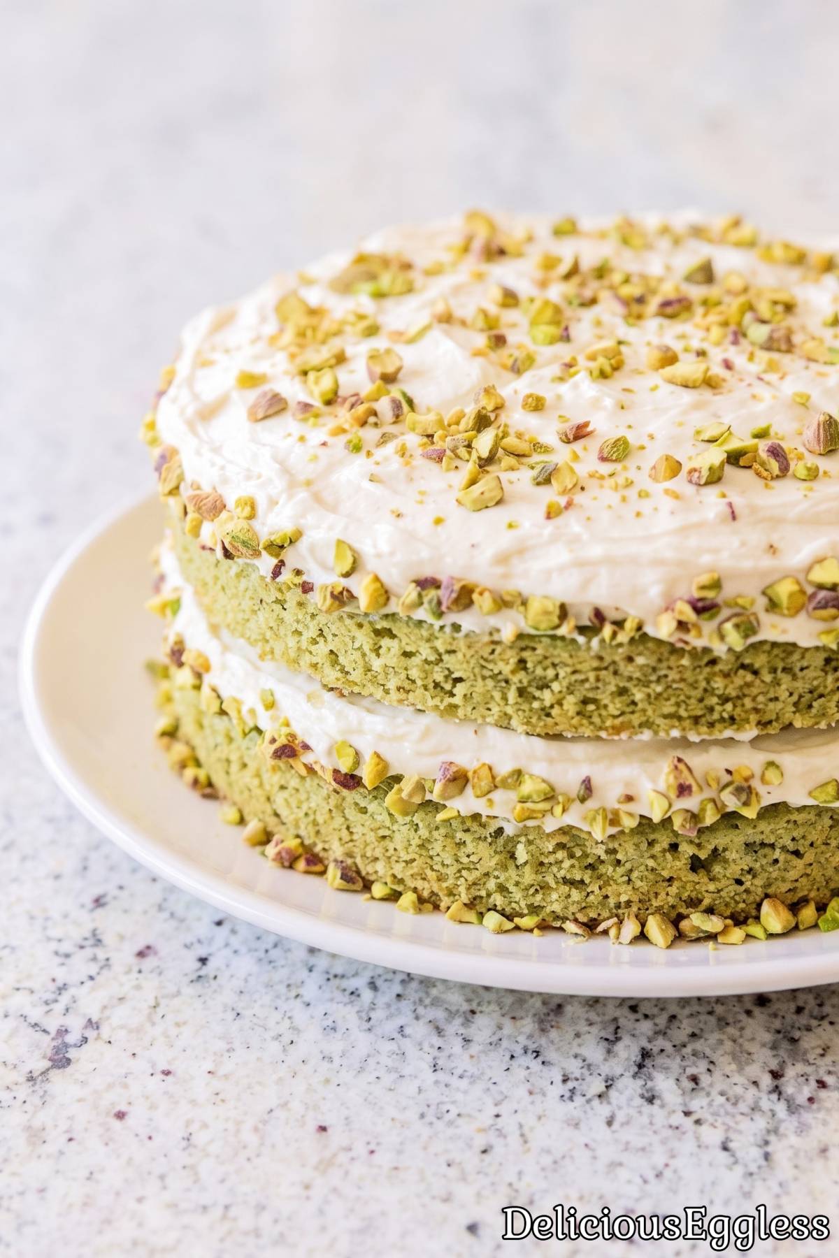 Slice of homemade eggless pistachio cake