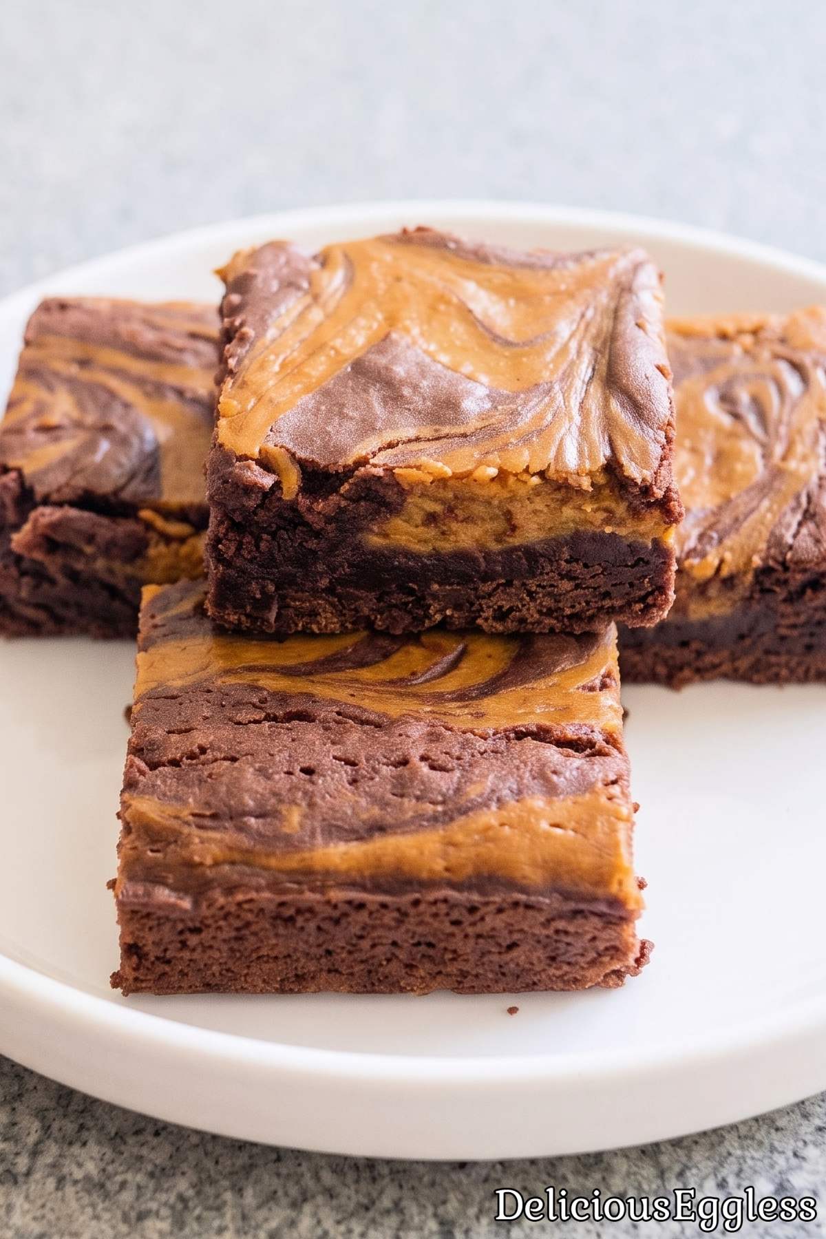 Fudgy eggless pumpkin cheesecake brownies
