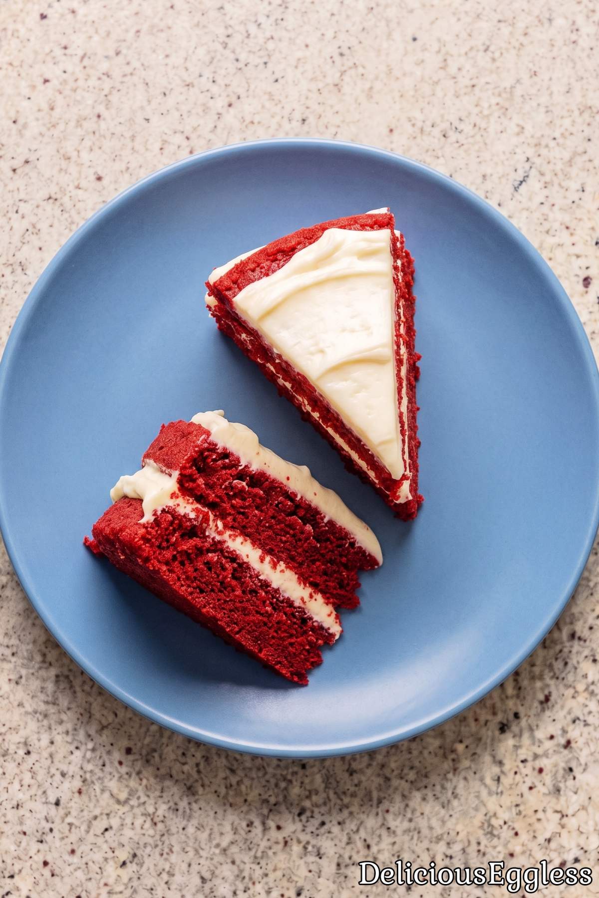 Slice of rich eggless red velvet layer cake