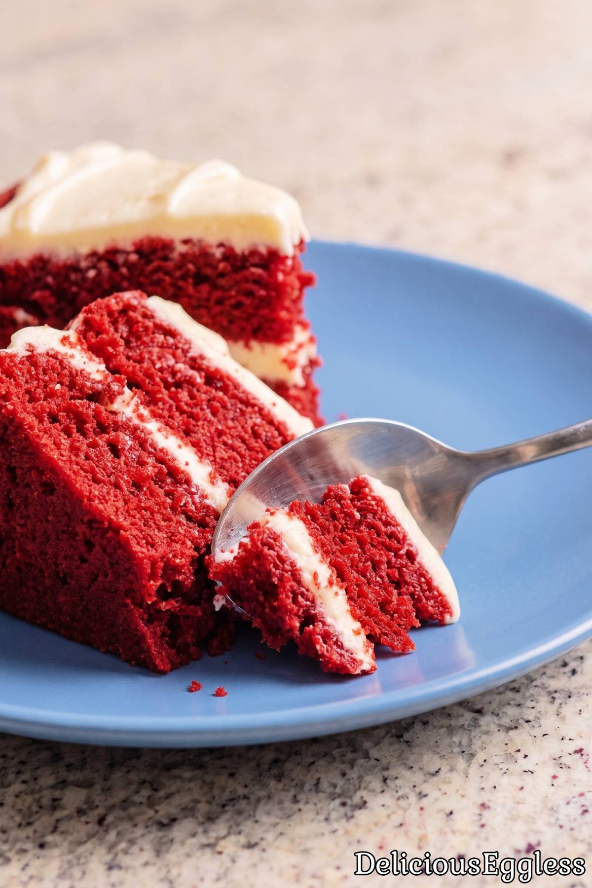 Tasty eggless red velvet layer cake slice