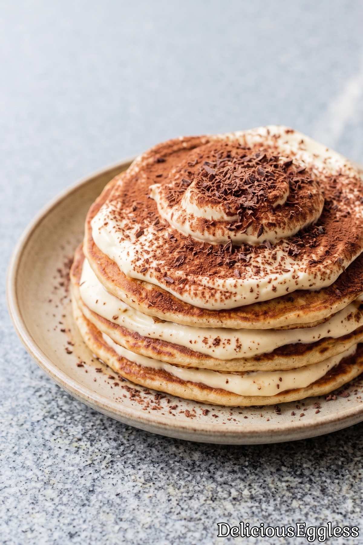 Warm eggless tiramisu pancakes on a plate