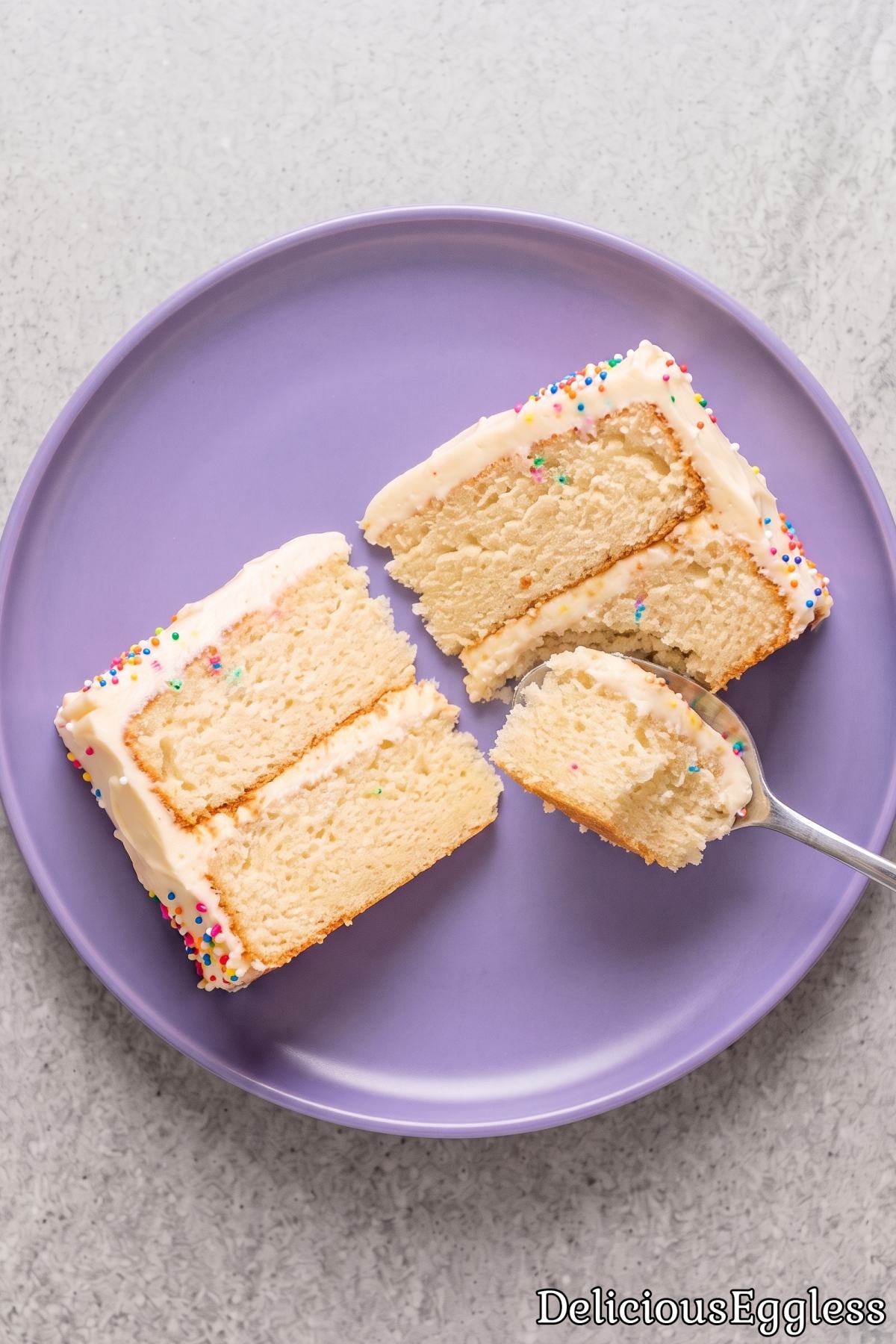 Slice of soft eggless vanilla birthday cake