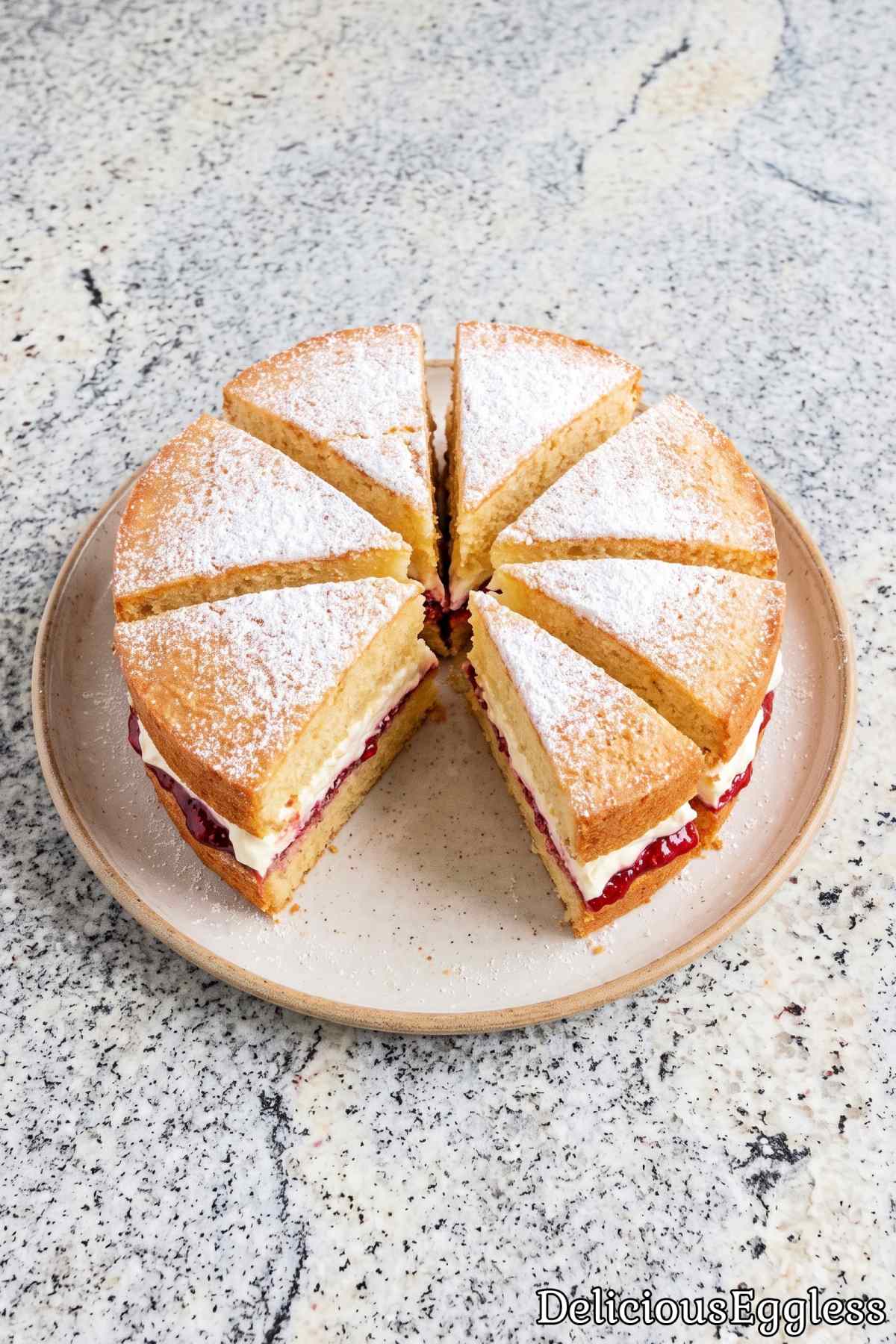 Soft dusted eggless Victoria sponge cake