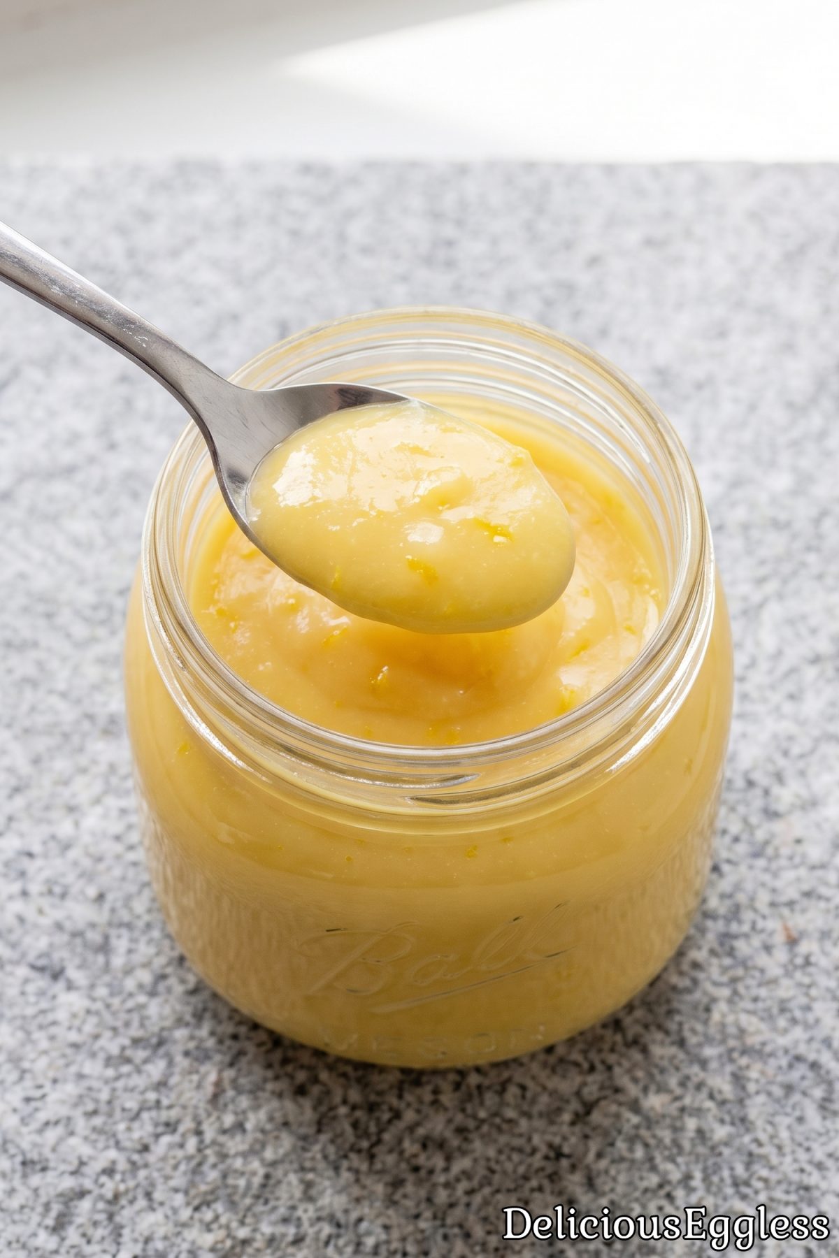 Jar of fresh zesty eggless lemon curd.